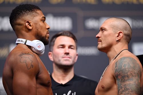 Anthony Joshua (left), Eddie Hearn (middle), Oleksandr Usyk (right) - Getty Images