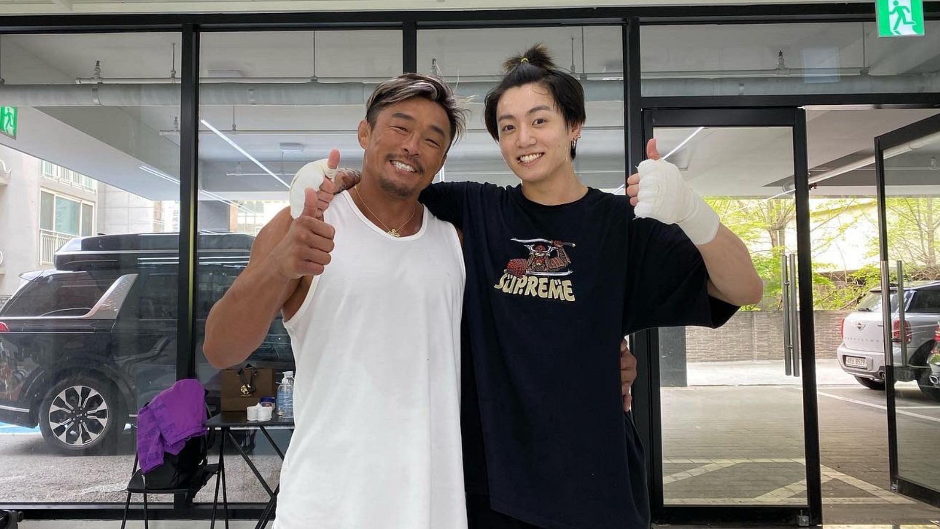 MMA fighter Choo Sung-hoon or &#039;Sexyama&#039; with BTS&#039; Jung Kook (Image via @akiyamayoshihir/Twitter)