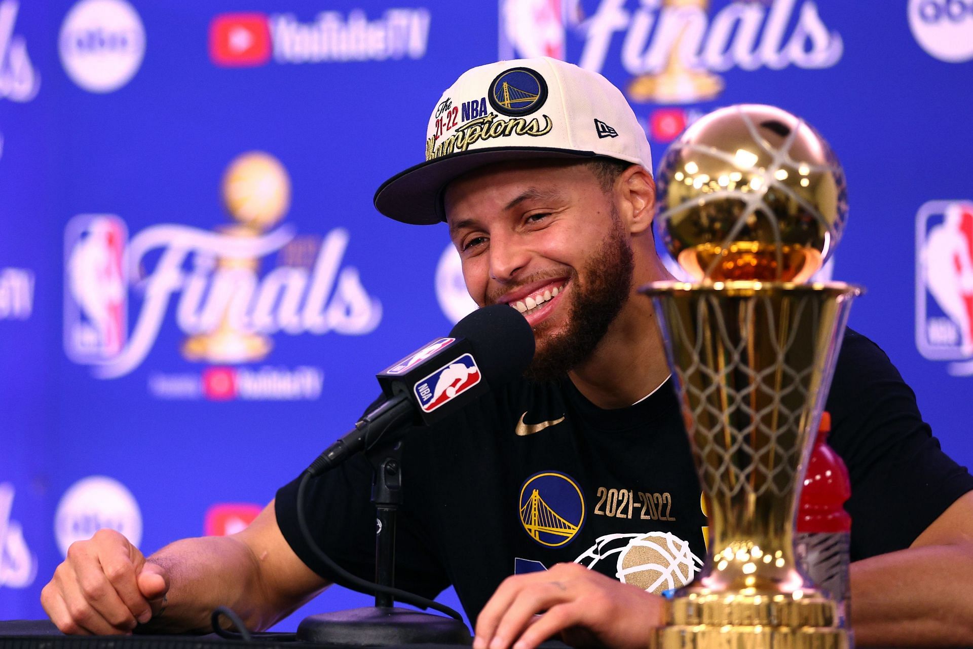 Steph Curry with the 2022 NBA Finals MVP award