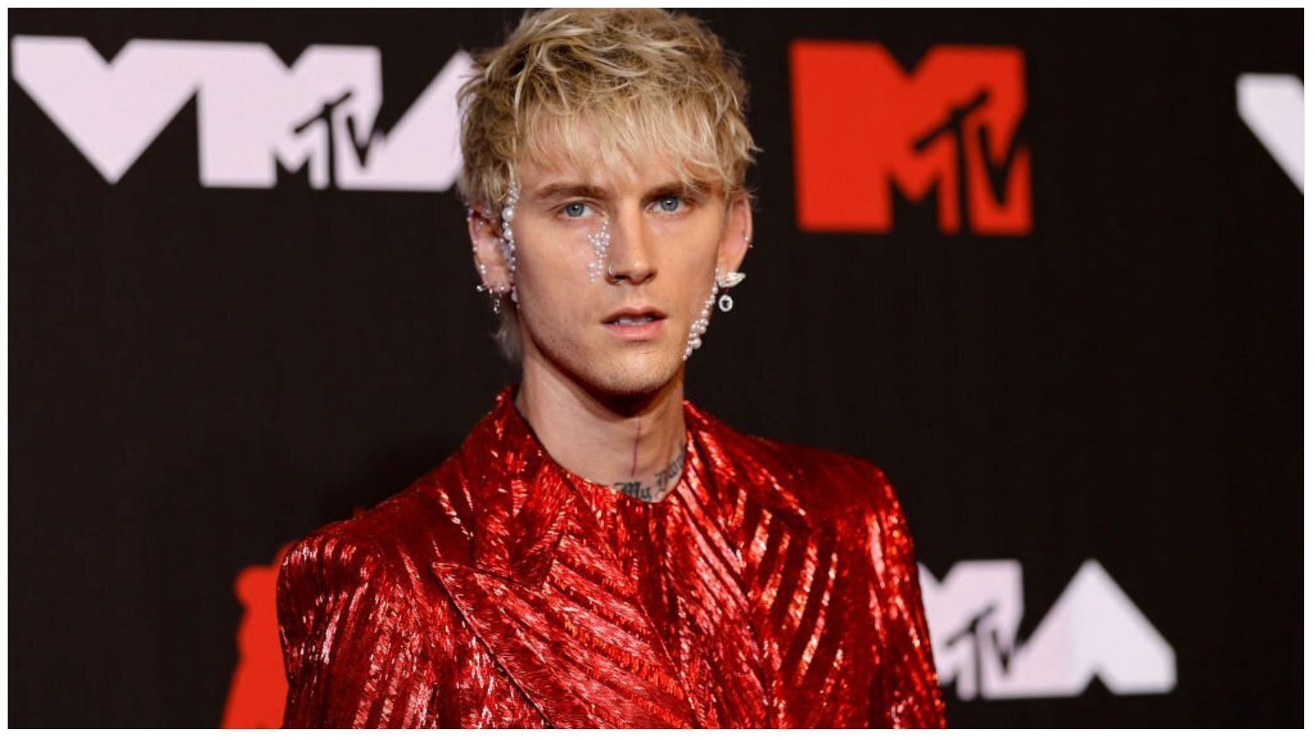 Machine Gun Kelly smashed a champagne bottle on his face at an afterparty (Image via Jason Kempin/Getty Images)