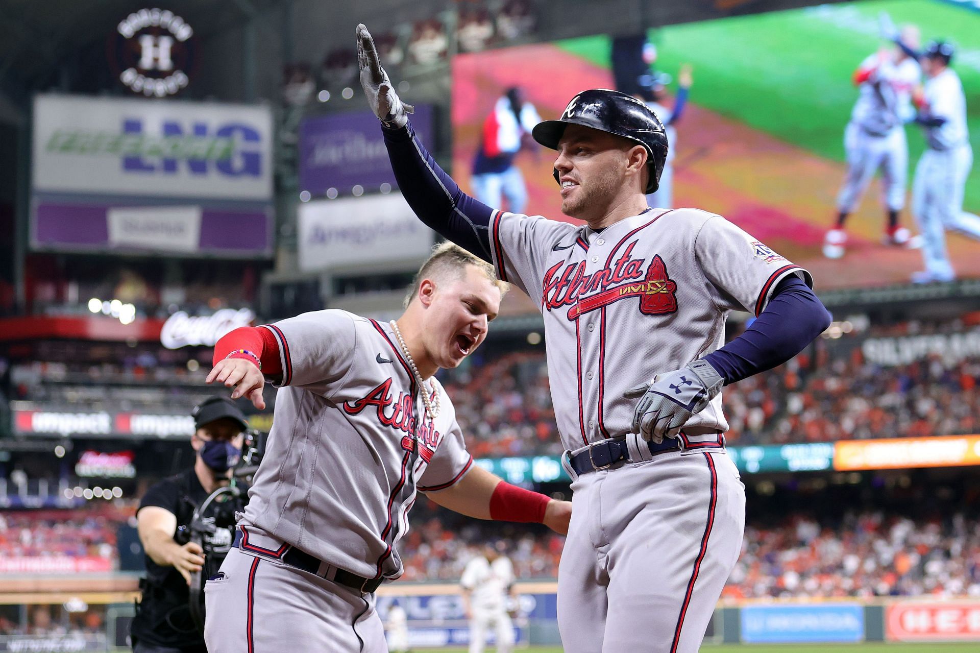 Joc Pederson (left) congratulates Freddie Freeman (right) after a home run during the MLB World Series - Atlanta Braves v Houston Astros - Game Six.