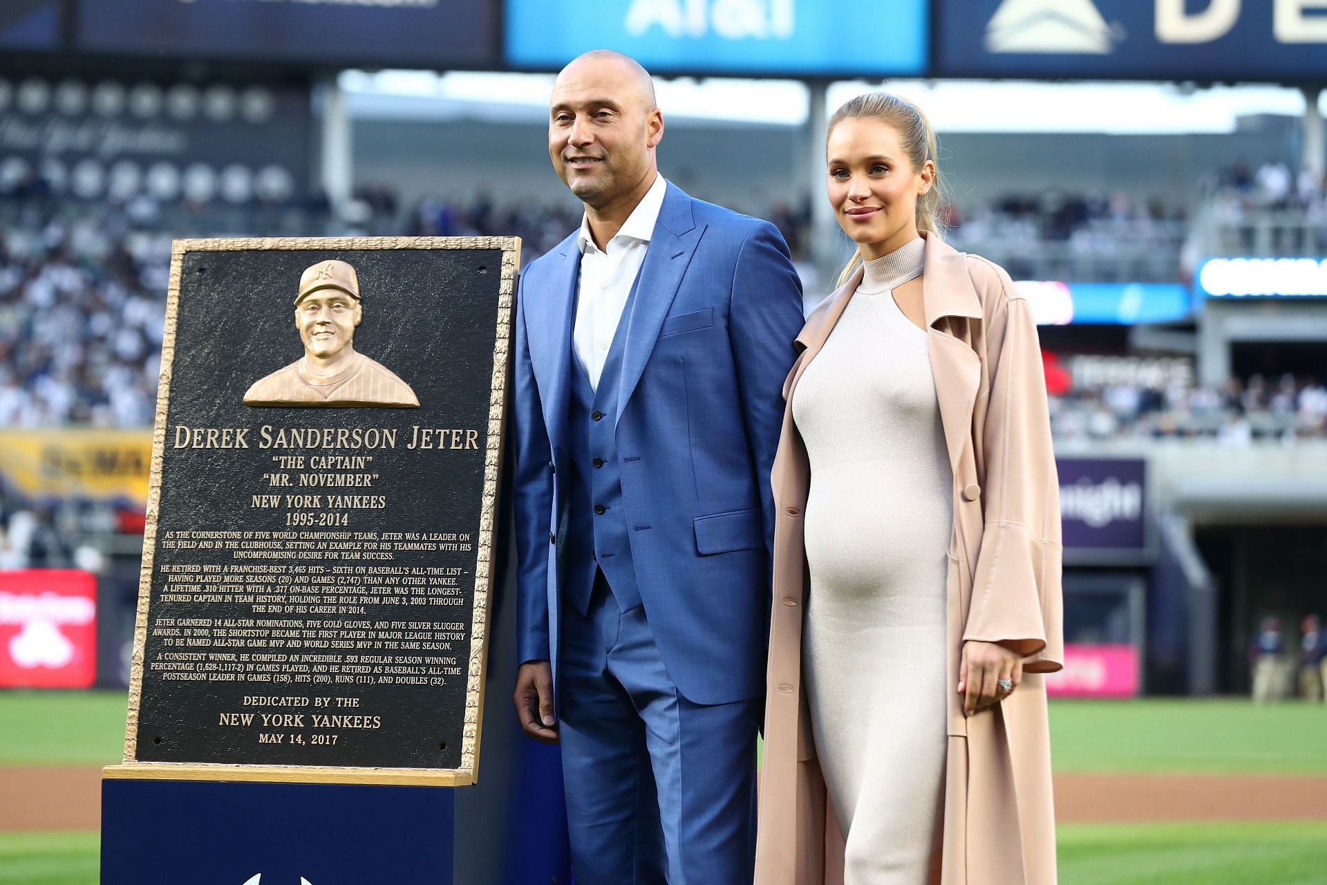 Derek Jeter poses with his wife Hannah Davis at Yankee Stadium on May 14, 2017 during the retiring ceremony for his number 2 jersey.