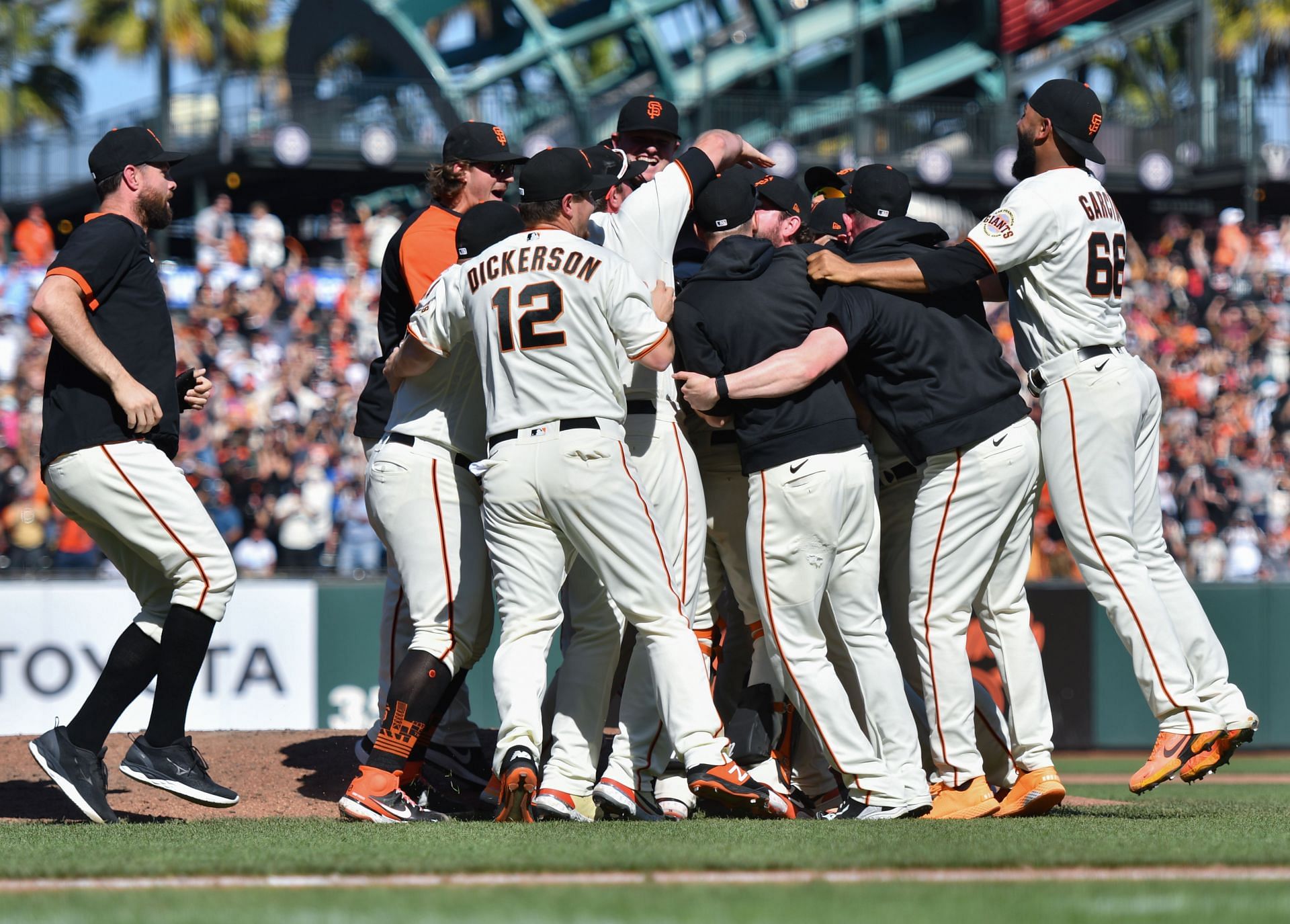 The San Francisco Giants celebrate as they clinch the NL West.