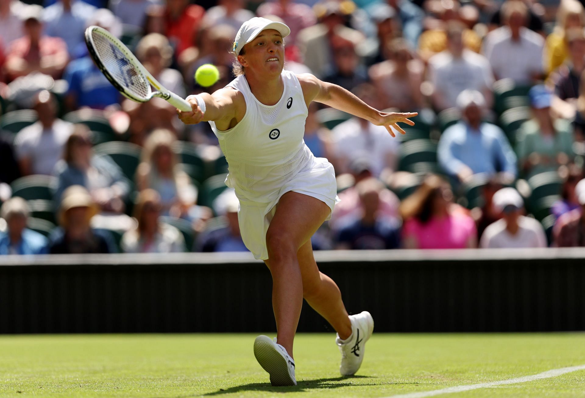 Iga Swiatek in action at the 2022 Wimbledon Championships.