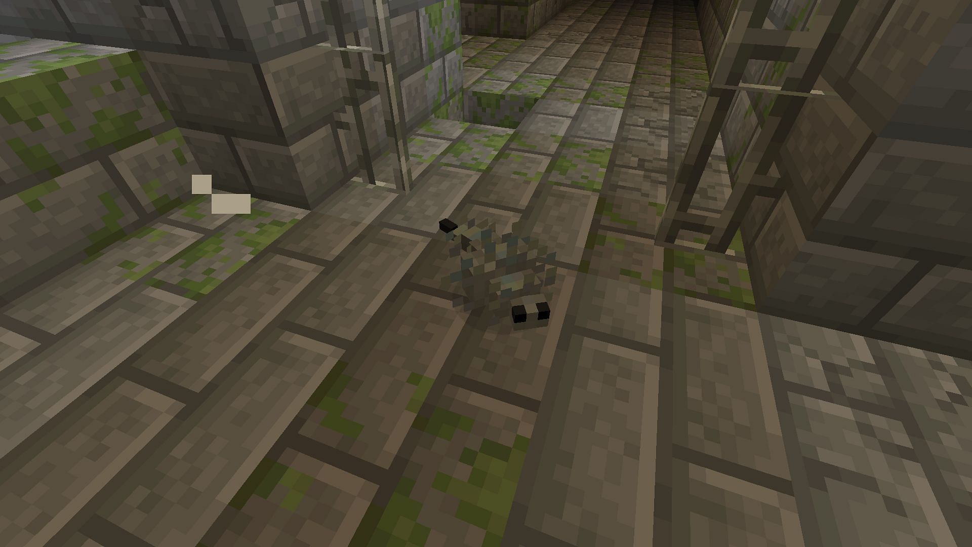 A silverfish spawned from an infested brick (Image via Minecraft)