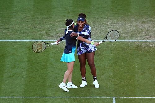 Serena Williams and Ons Jabeur share a hug as they mark their second win as a pair