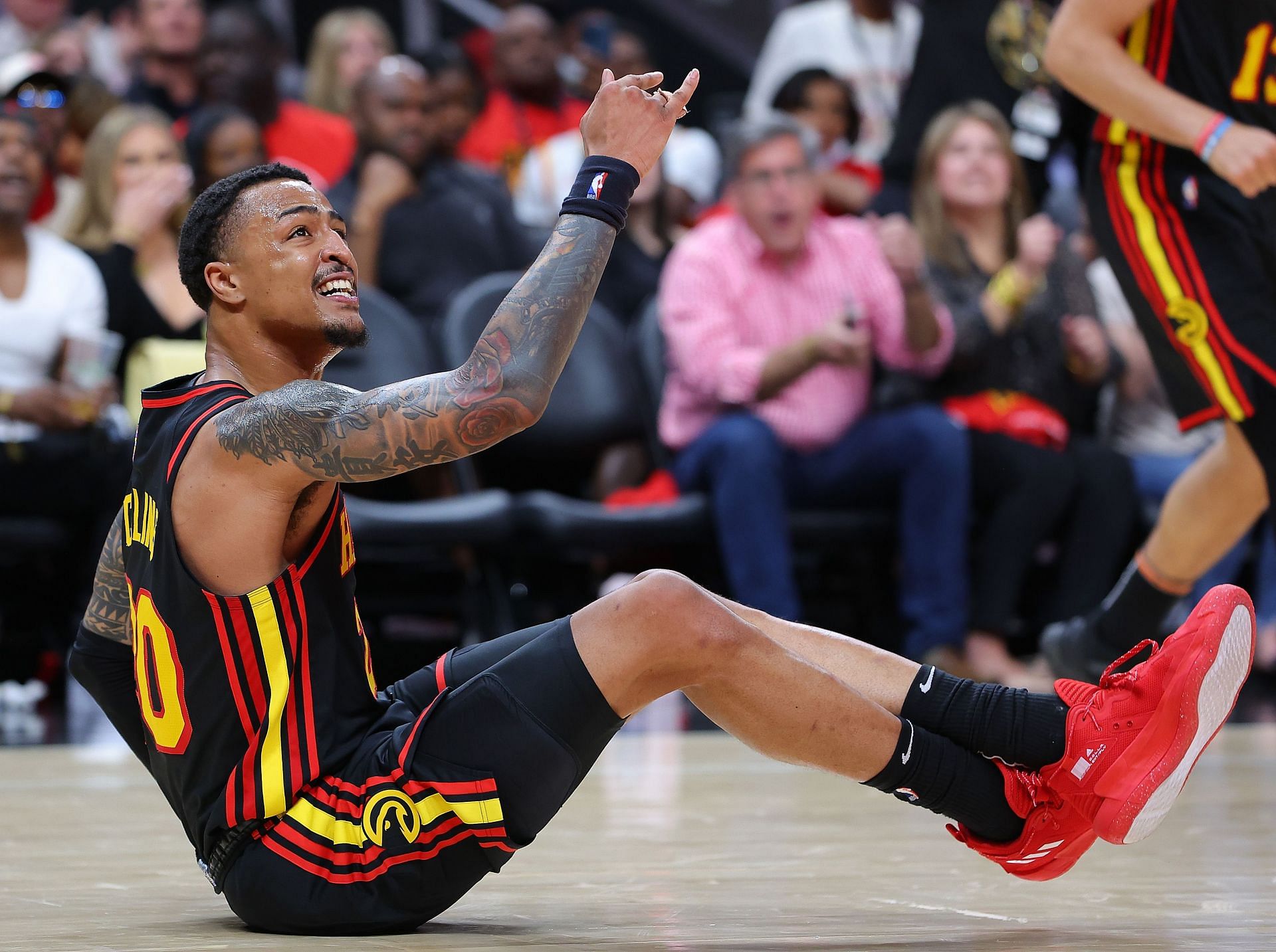 John Collins of the Atlanta Hawks reacts during a game