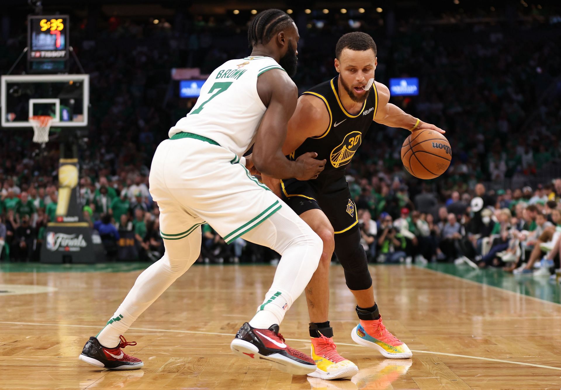 Steph Curry of the Golden State Warriors drives against Jaylen Brown of the Boston Celtics in the fourth quarter of Game 3 of the NBA Finals at TD Garden on Wednesday in Boston, Massachusetts