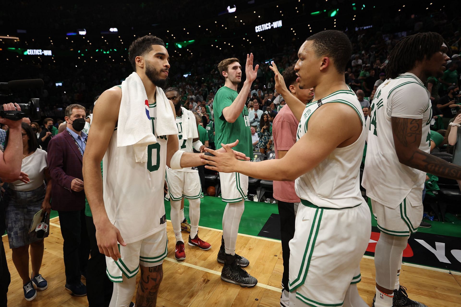 Jayson Tatum (0) and Grant Williams of the Boston Celtics celebrate their 116-100 win against the Golden State Warriors after Game 3 on Wednesday in Boston, Massachusetts.