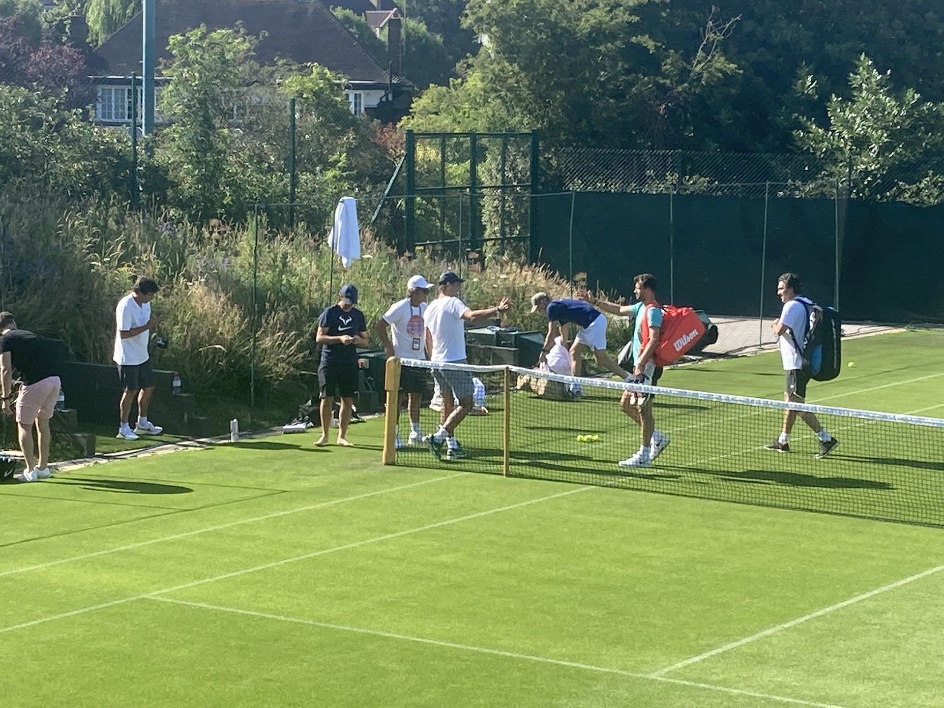 Rafael Nadal greets Grigor Dimitrov ahead of their practice session in London