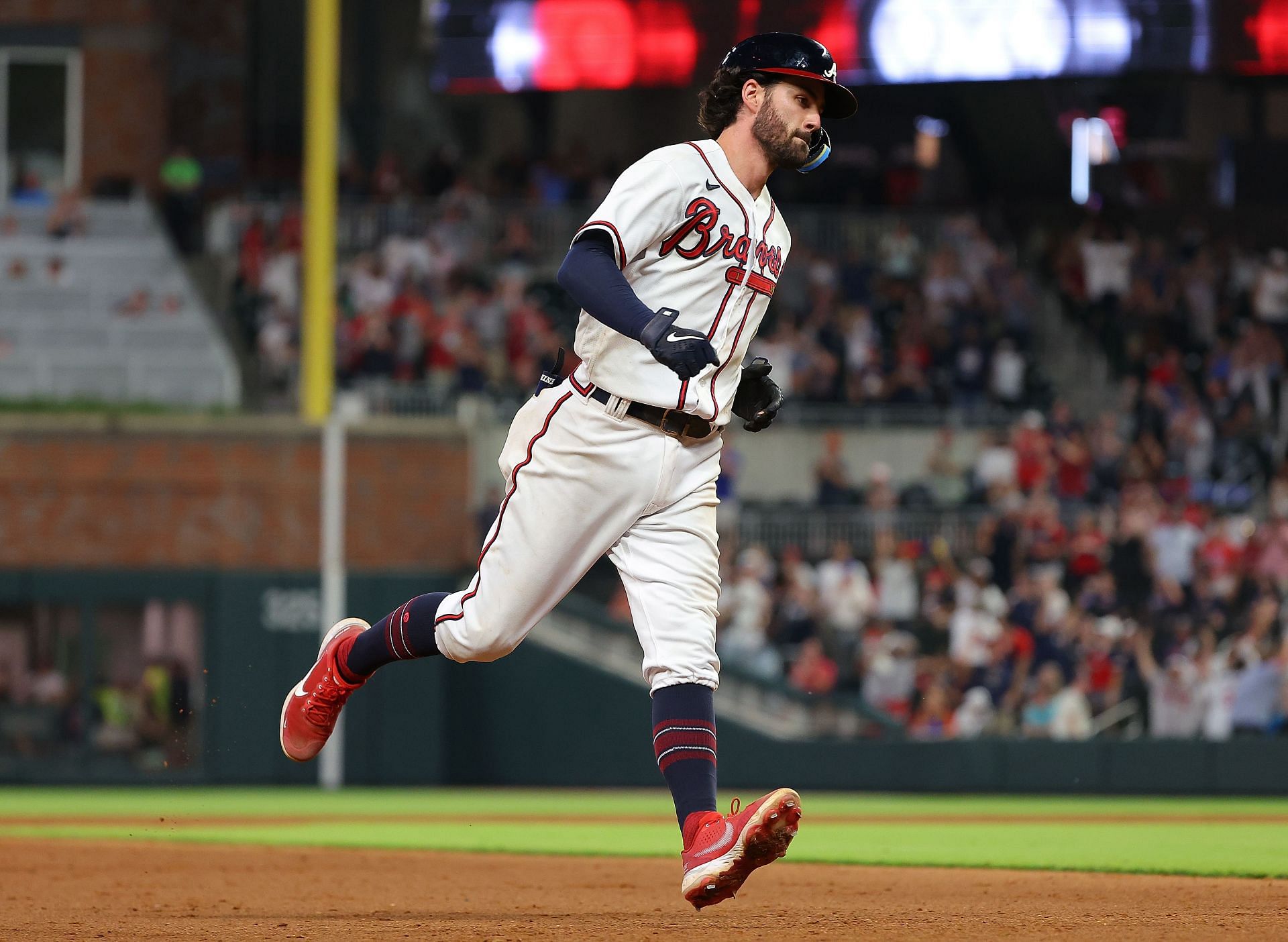 Braves shortstop rounding the bases after lead-off homer.