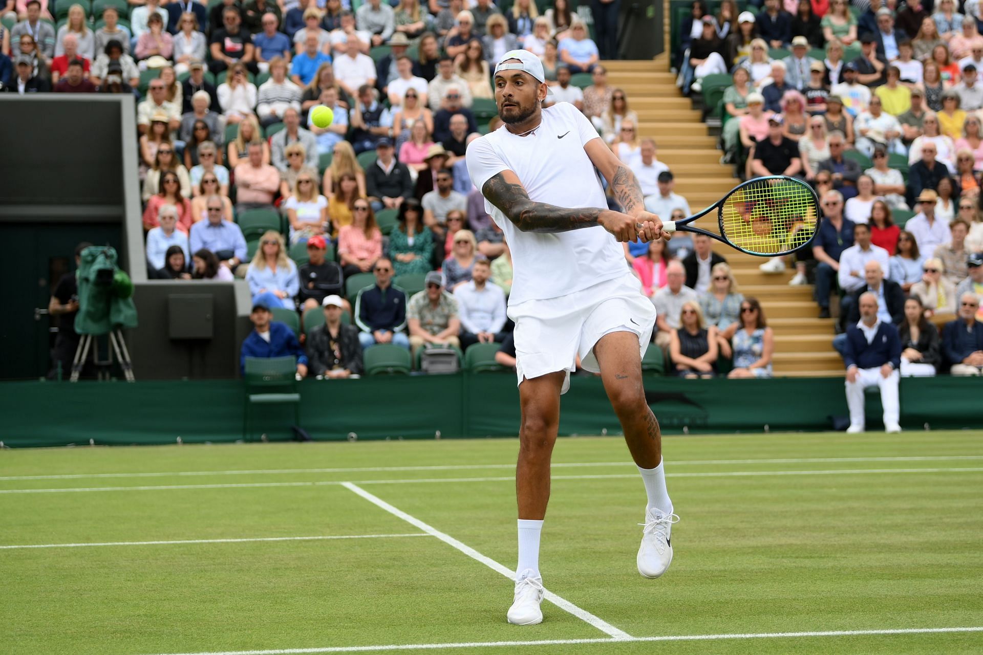 Nick Kyrgios in action at The Championships - Wimbledon 2022