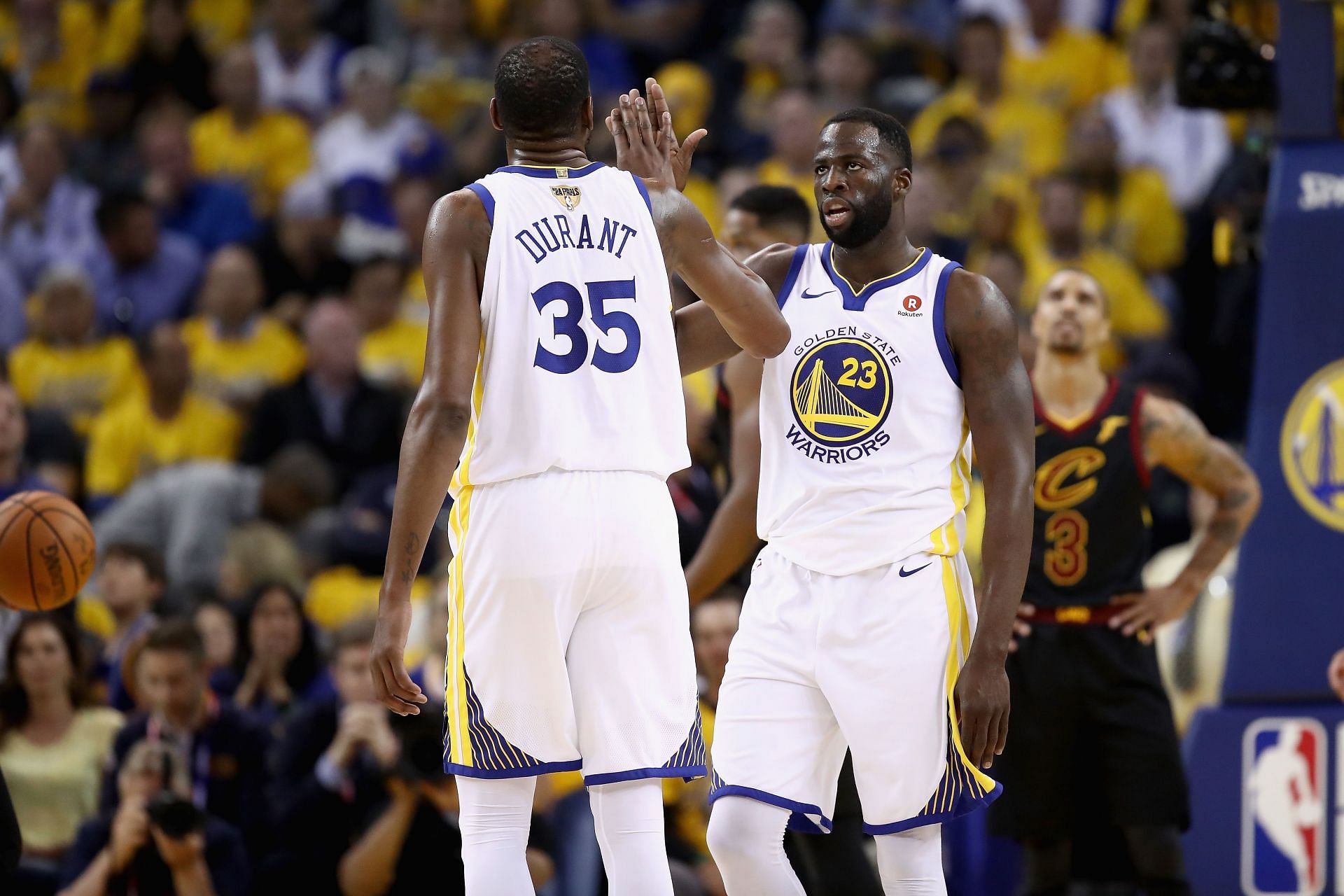 Kevin Durant, left, and Draymond Green, right.