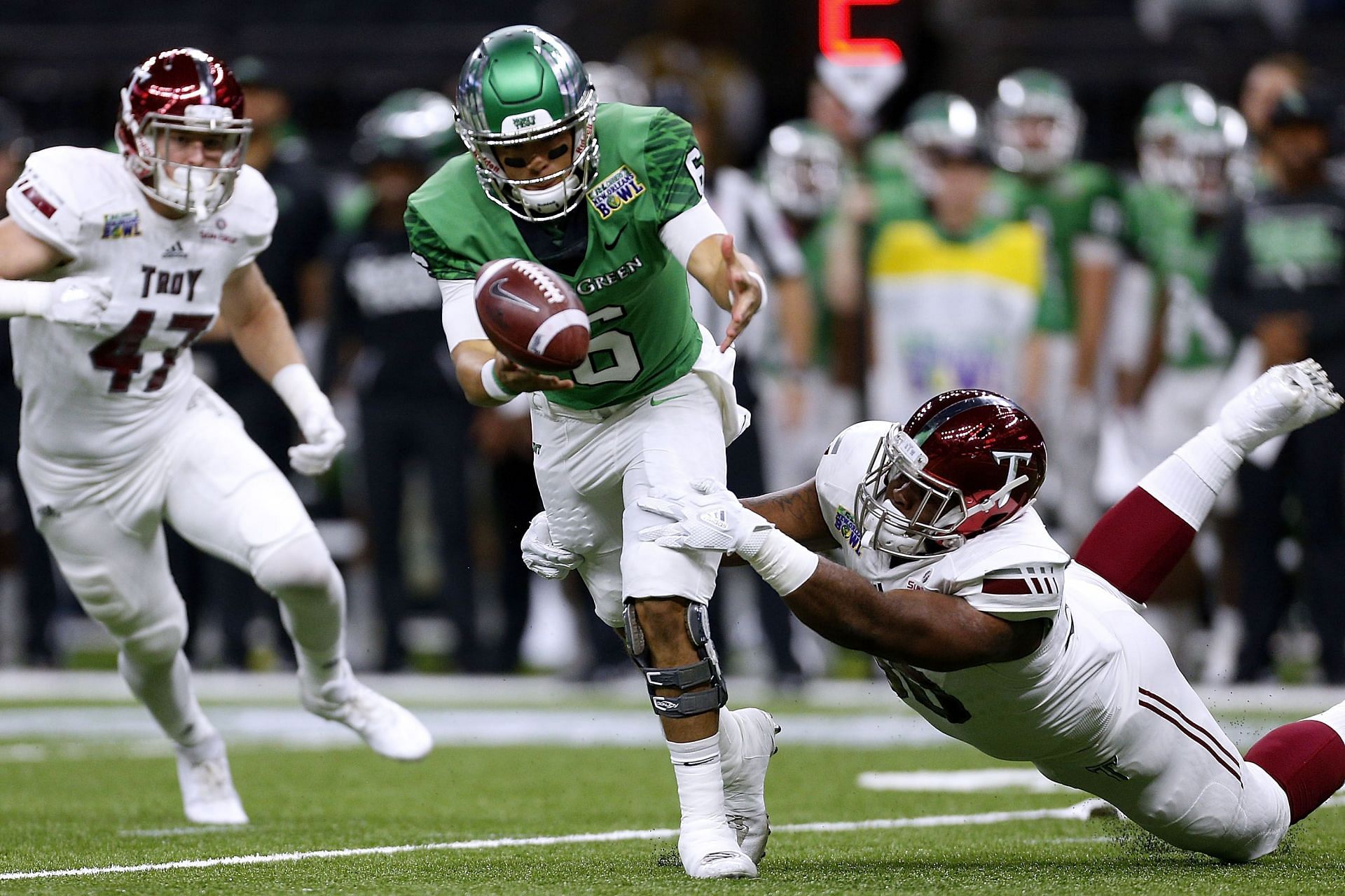 Troy defensive lineman Trevon Sanders forces a fumble