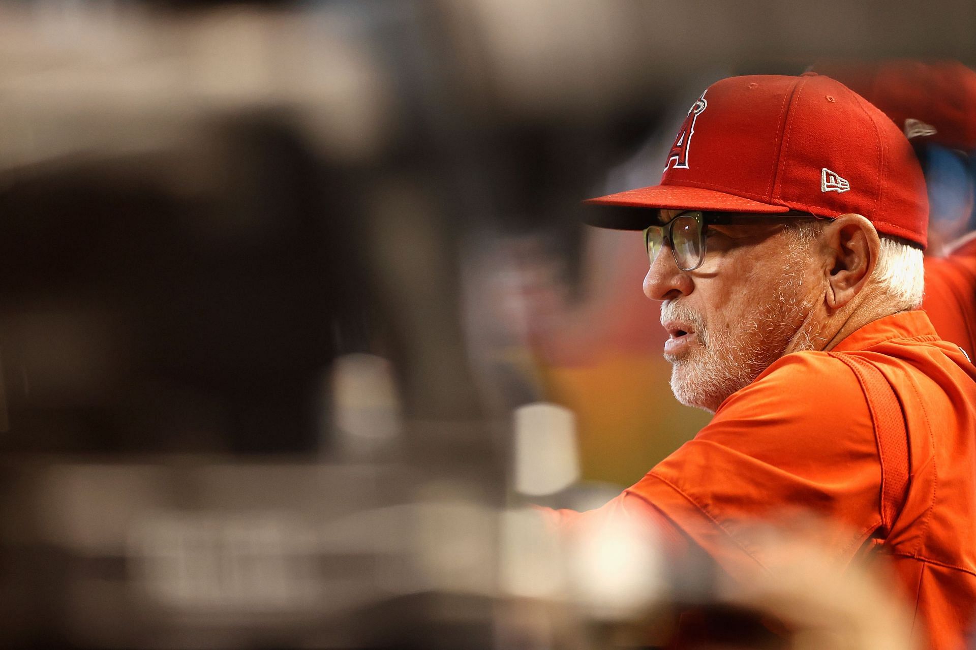 Former Angel&#039;s manager Joe Maddon watches from the dugout.