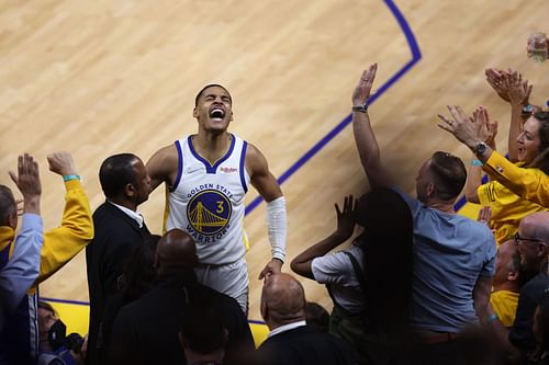 Jordan Poole celebrates with the crowd