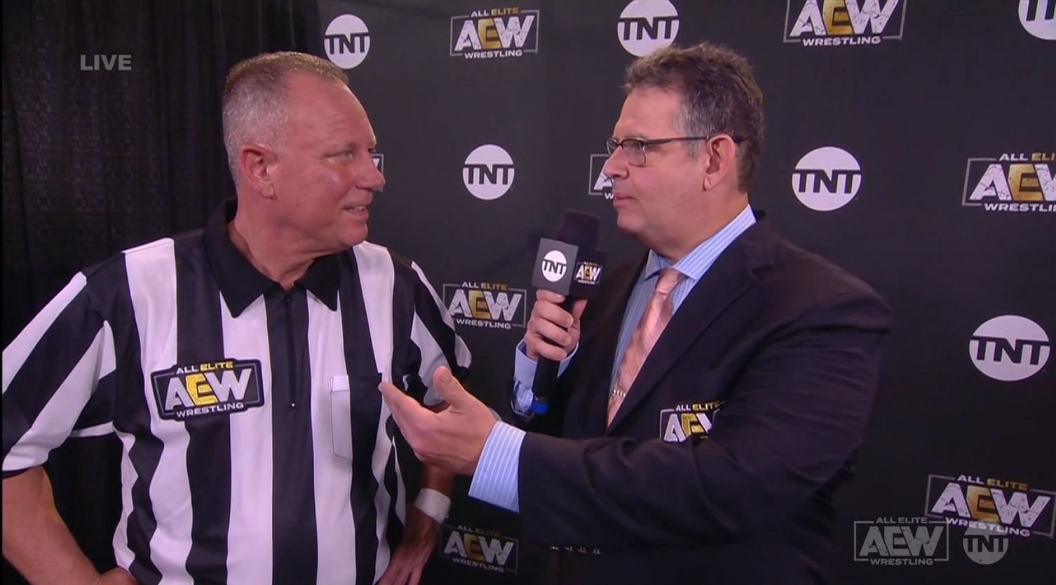 Former WWE referee Mike Chioda while being interviewed by Alex Marvez in AEW.