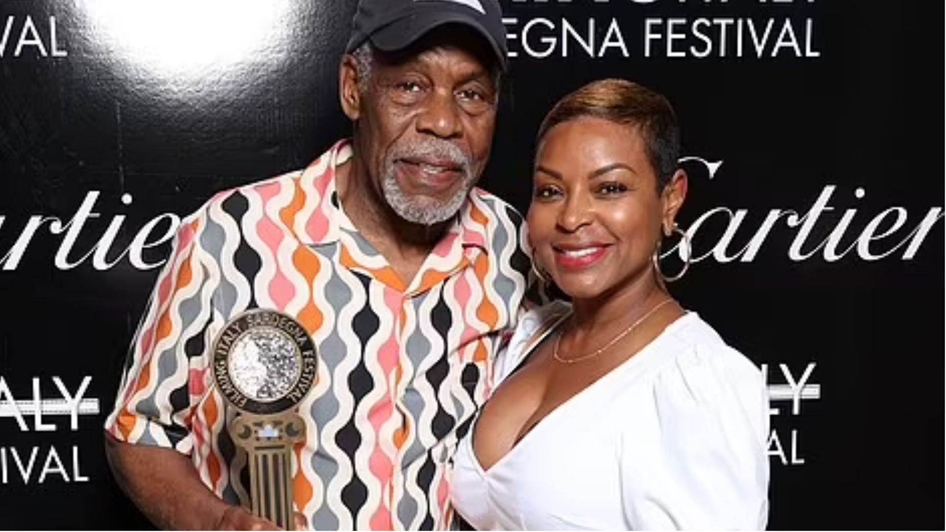 Danny Glover and Regina Murray. (Image via Getty Images)