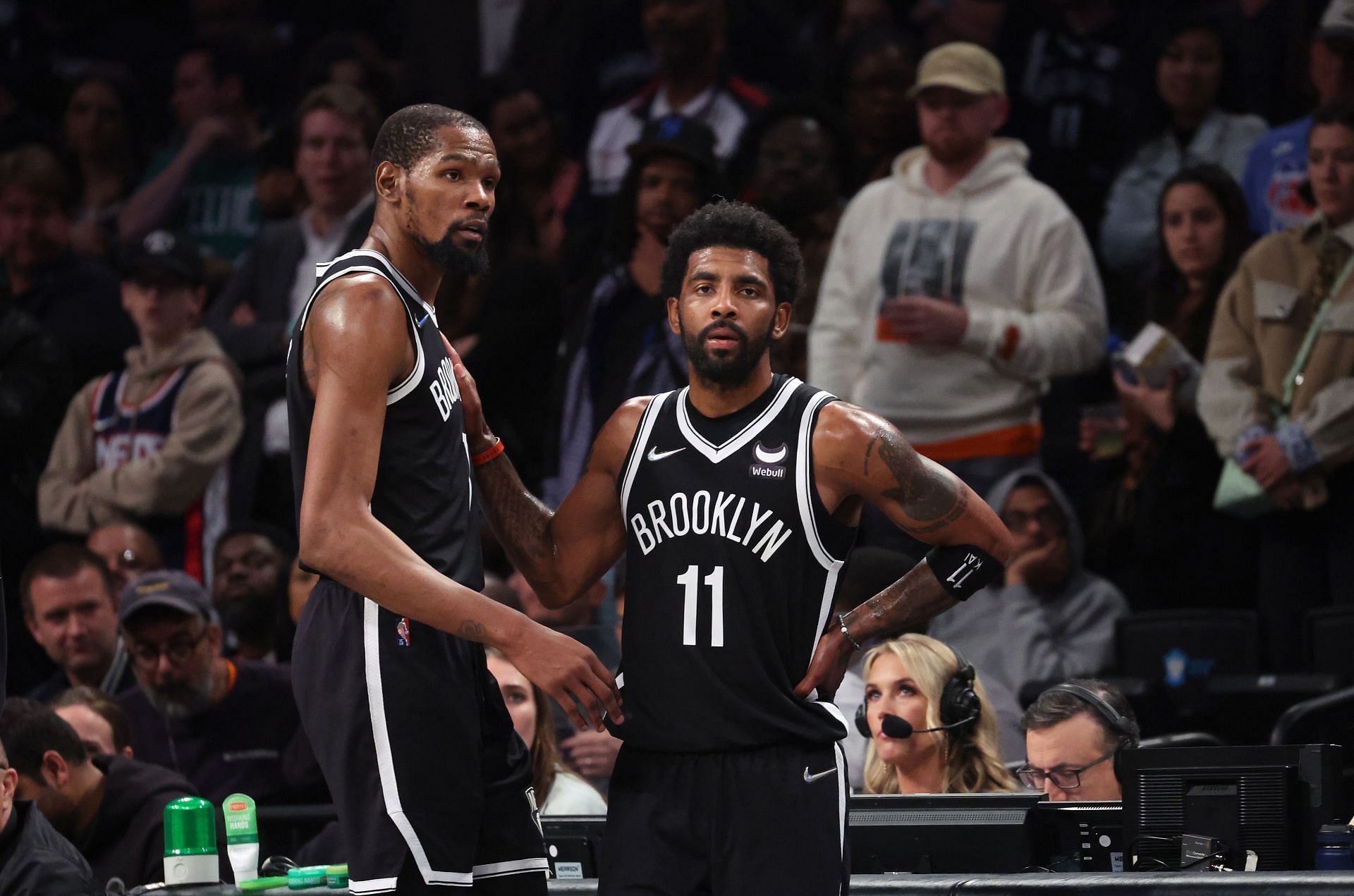 Kevin Durant #7 and Kyrie Irving #11 of the Brooklyn Nets look on in the final seconds of their 109-103 loss against the Boston Celtics during Game Three of the Eastern Conference First Round NBA Playoffs at Barclays Center on April 23, 2022 in New York City