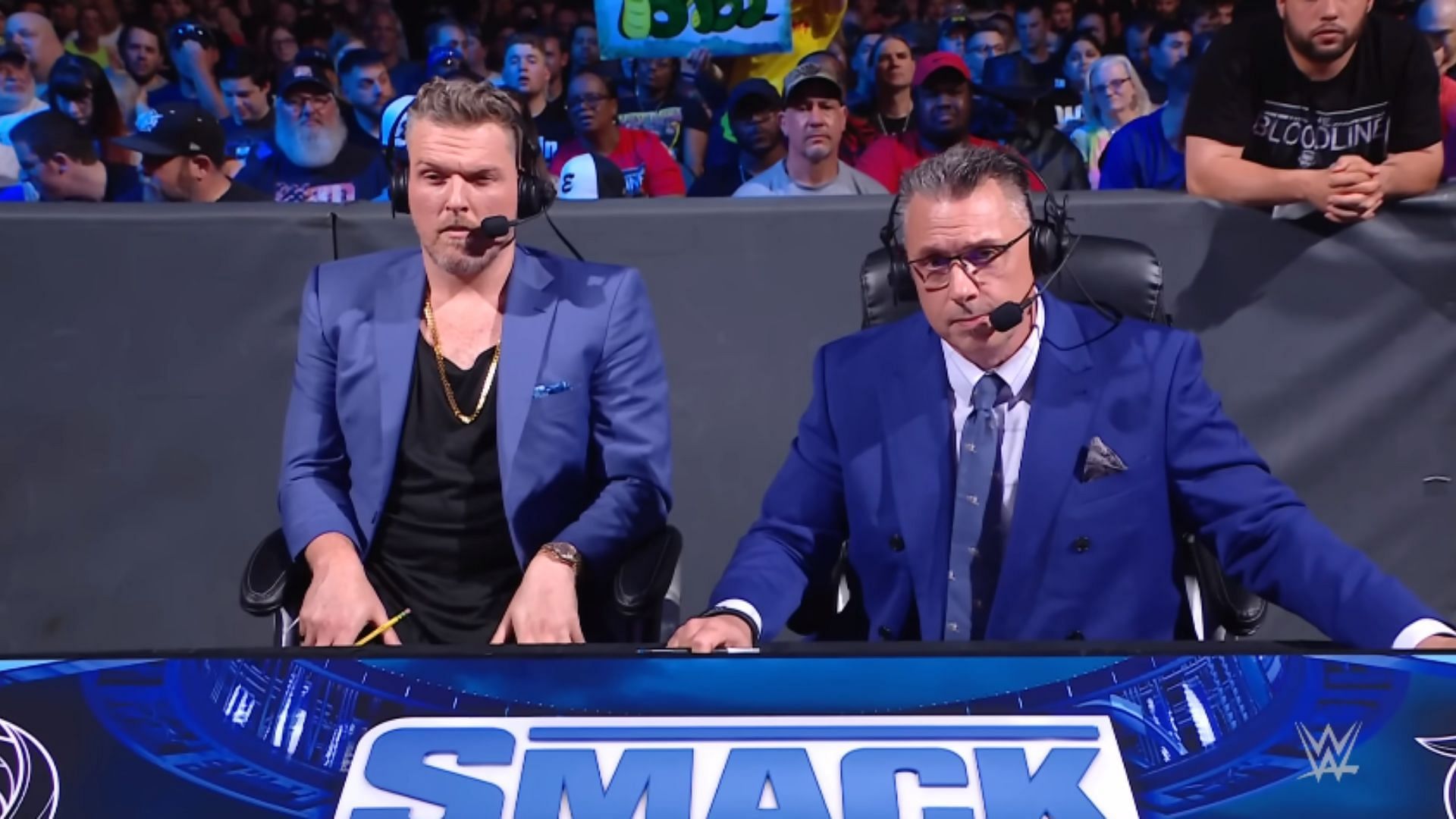 Pat McAfee (left) and Michael Cole (right)