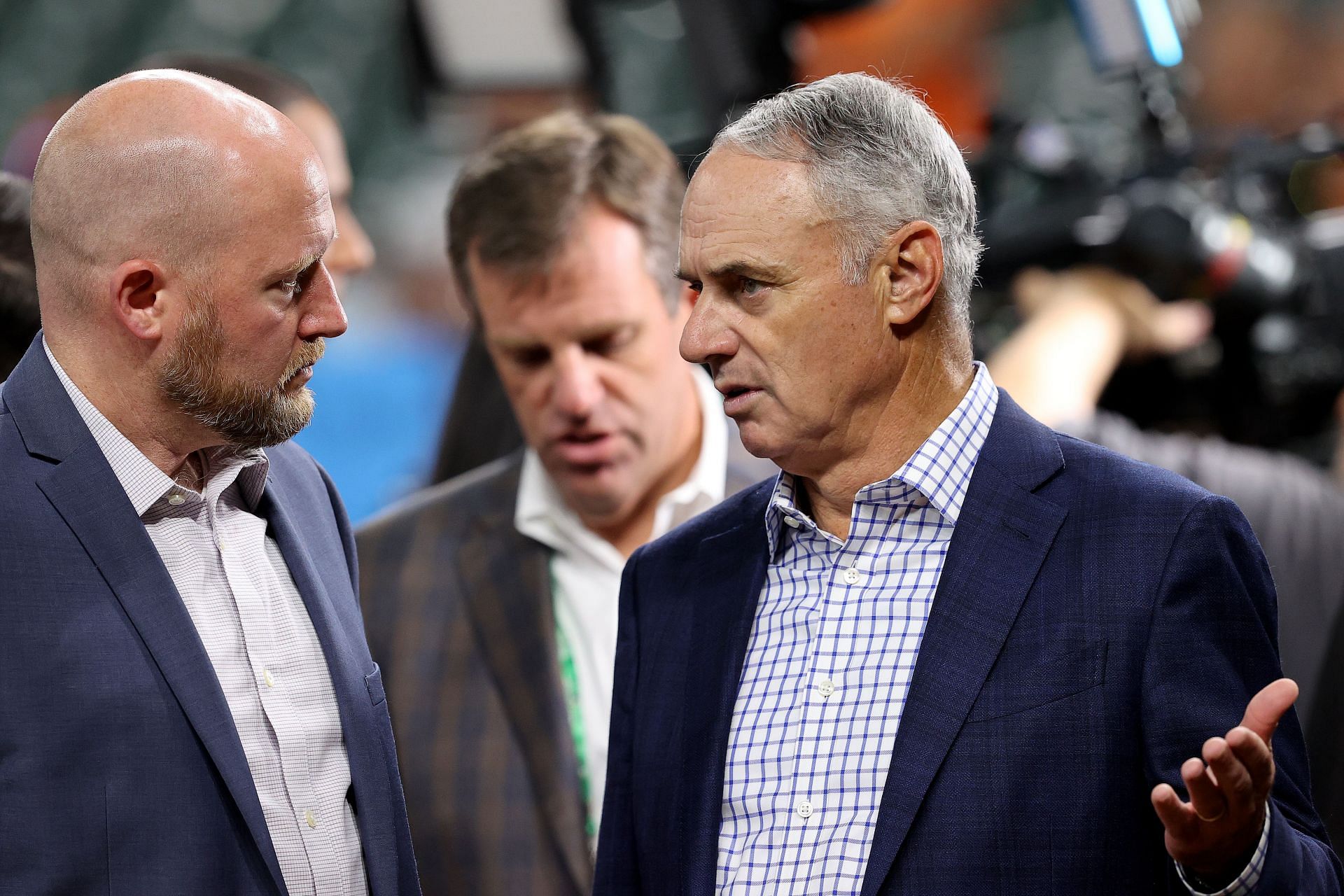 MLB Commissioner Rob Manfred (R) talks with General manager James Click (L) of the Houston Astros.
