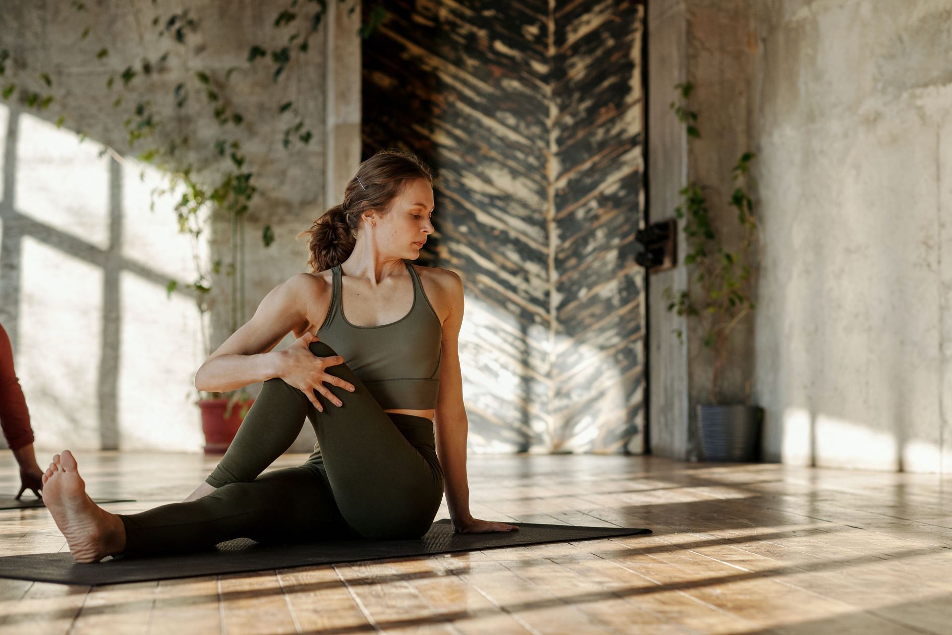 Easy yoga poses can help people with Irritable bowel syndrome (IBS) symptoms. (Image via Pexels / Cliff Booth)
