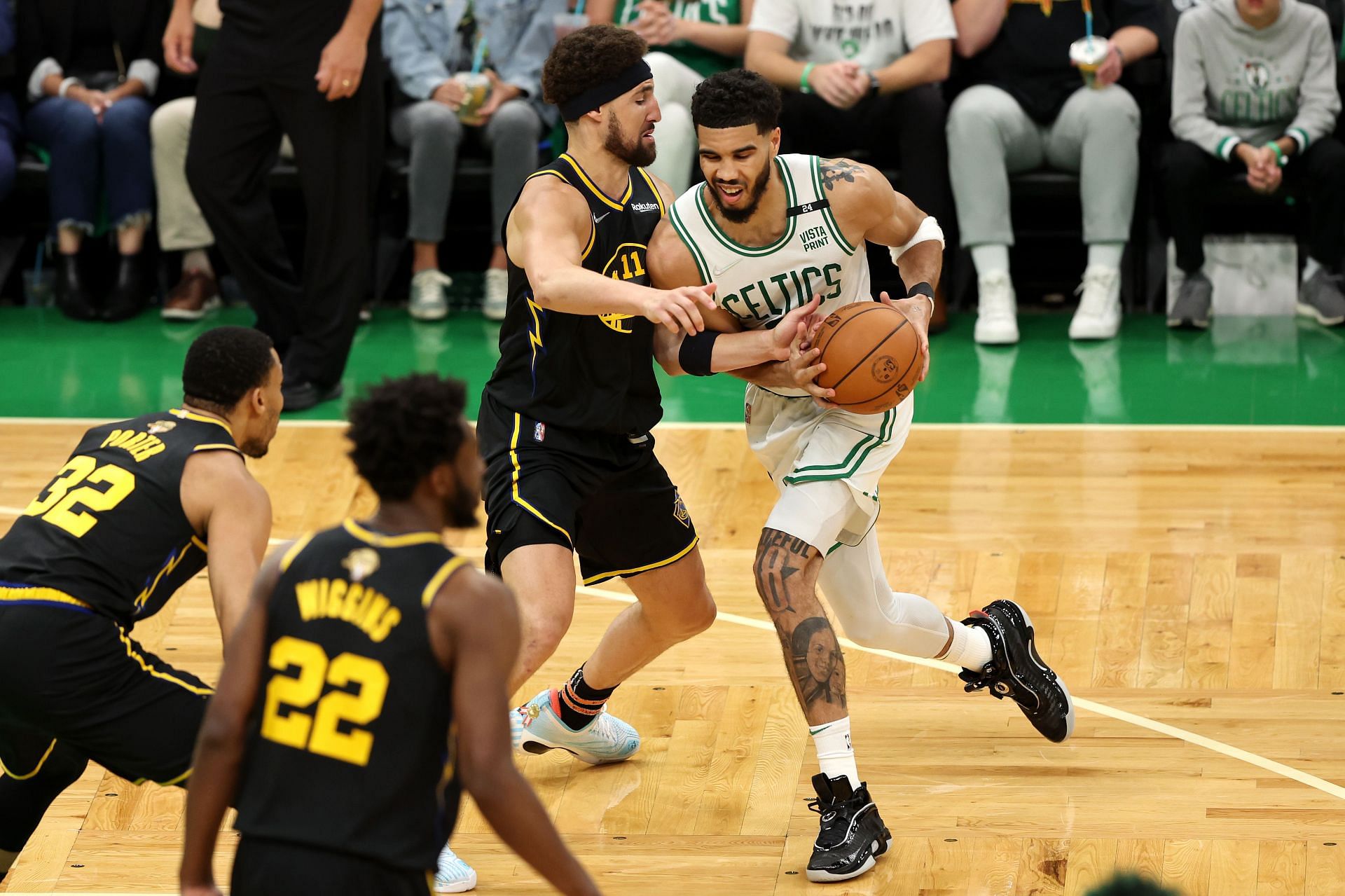 Jayson Tatum drives to the basket against Klay Thompson in Game 3.
