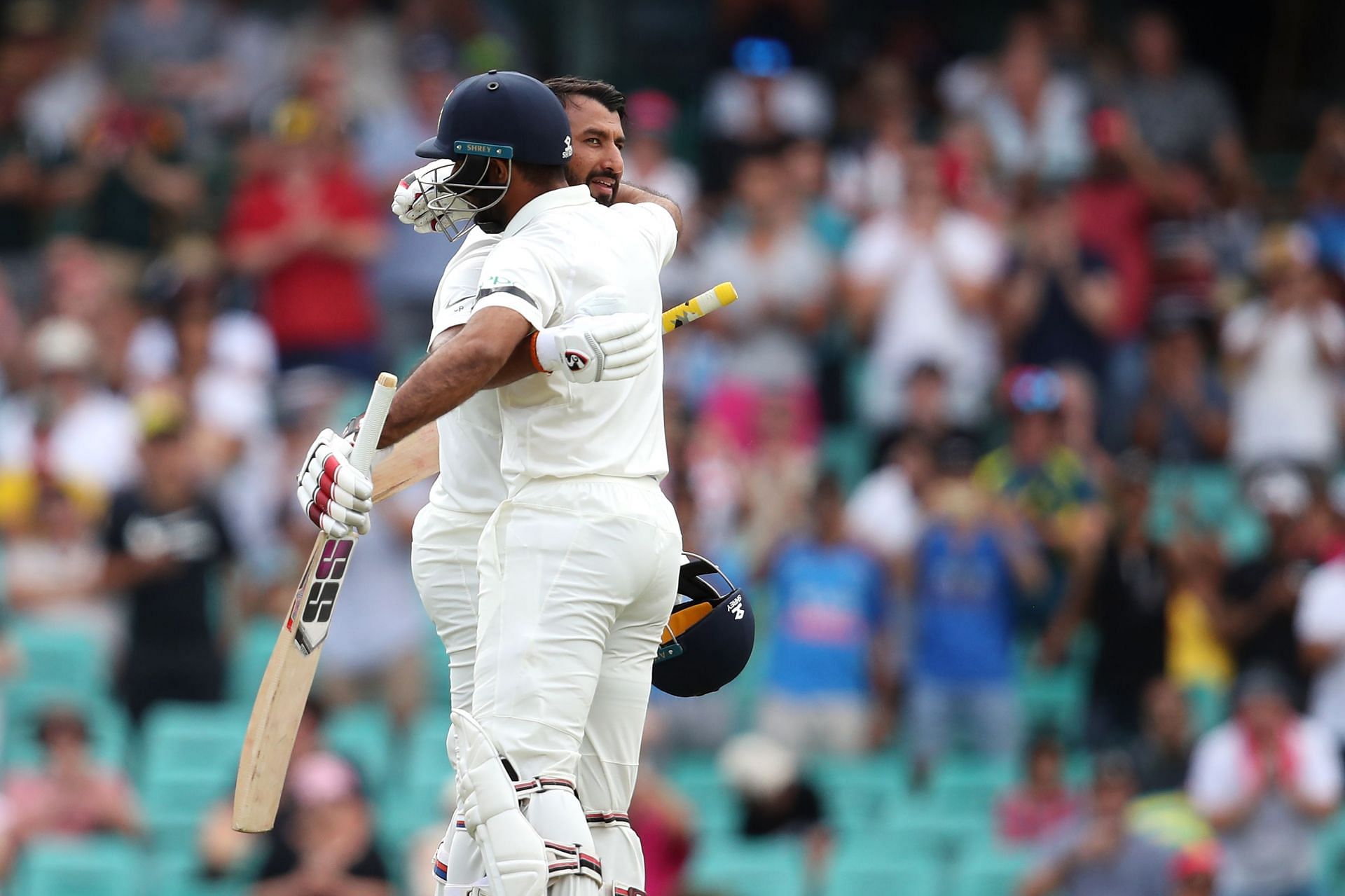 Cheteshwar Pujara (left) celebrates with Hanuma Vihari after scoring a century during the 2019 Sydney Test. Pic: Getty Images