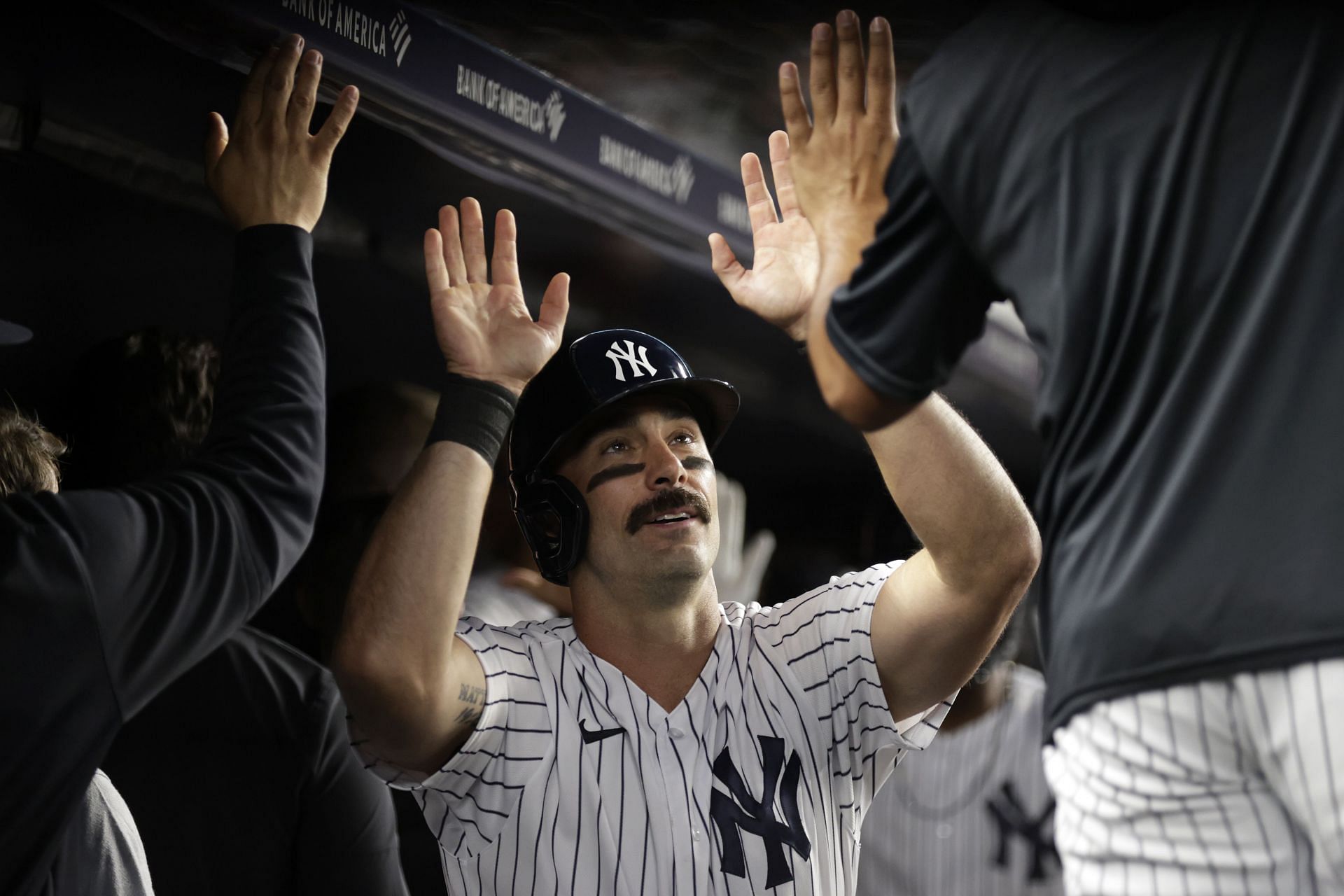 Matt Carpenter of the New York Yankees celebrates in the dugout during a game against the Detroit Tigers.
