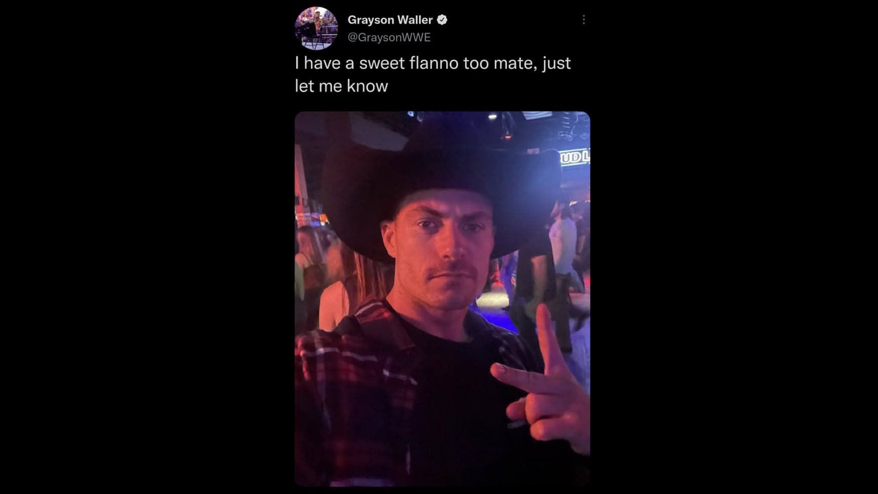 Grayson Waller dons a Lesnar cowboy hat.