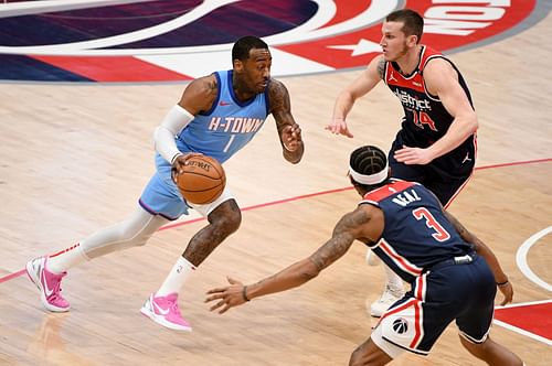 Houston Rockets guard John Wall drives against the Washington Wizards.