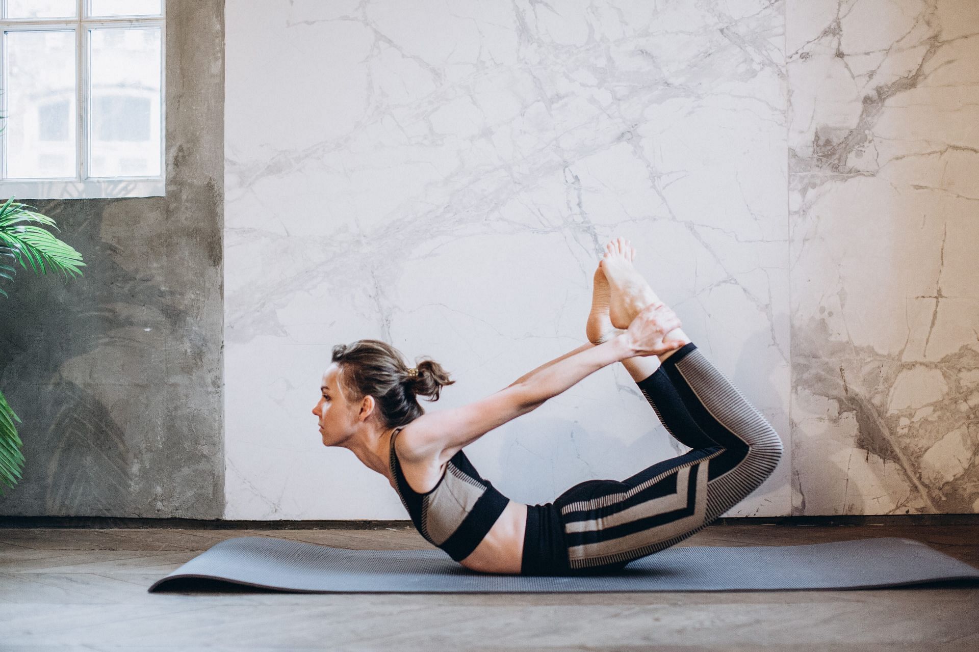 Dhanurasana stretches your muscles in preparation for Natarajasana (Image from Pexels @Elina Fairytale)