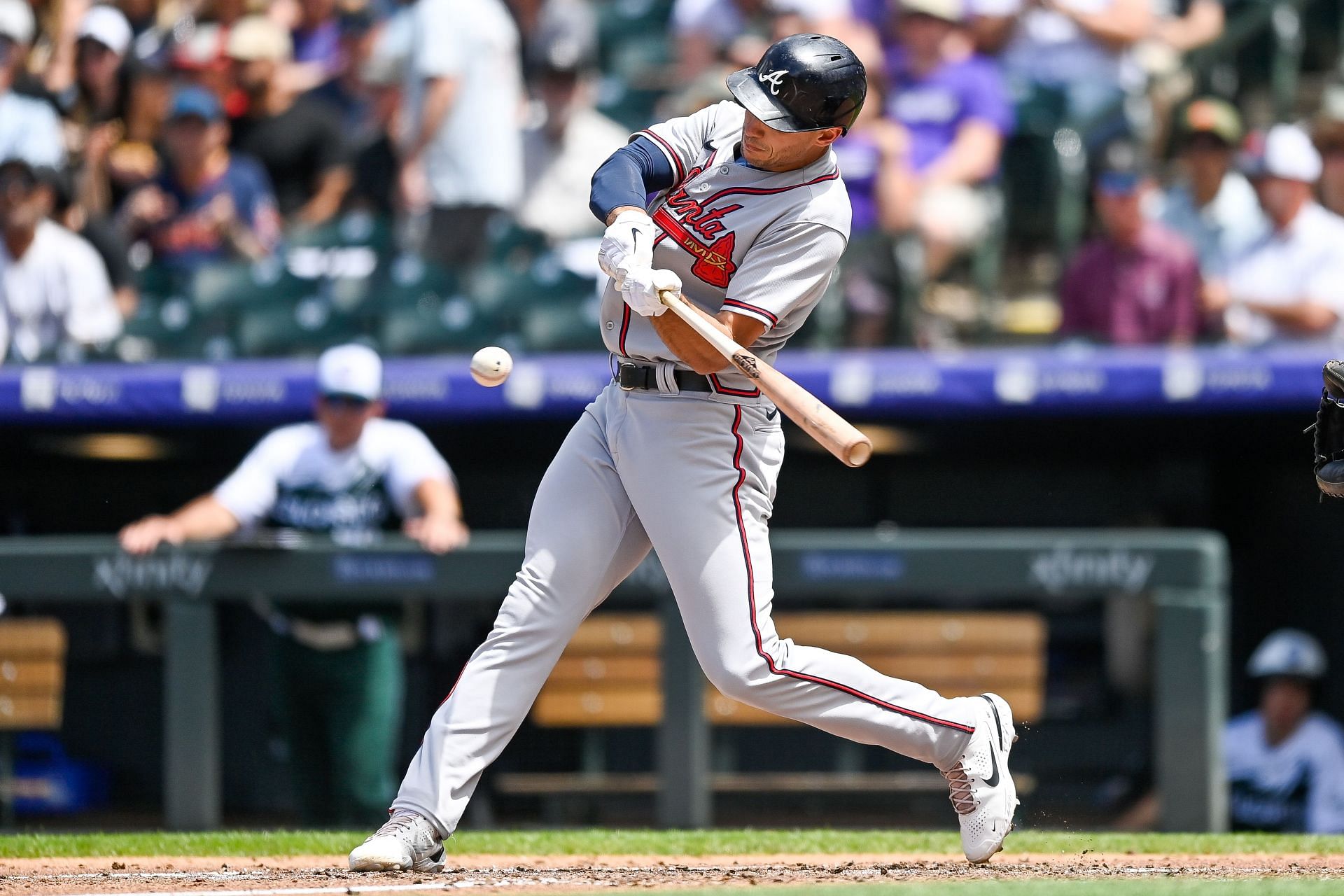 Matt Olson hits a three-run homer during an Atlanta Braves v Colorado Rockies game.