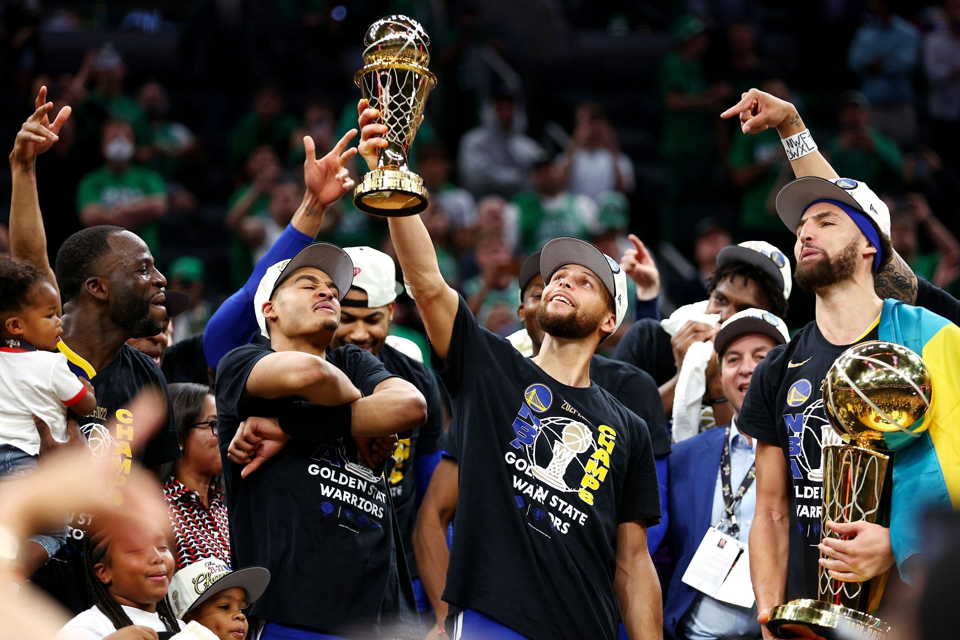 Stephen Curry hoists his first Finals MVP award.