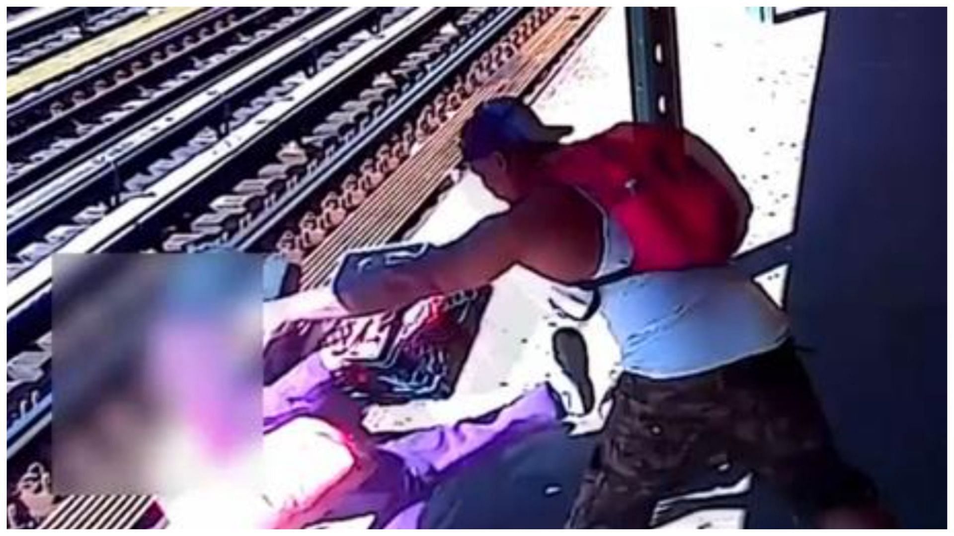 A screengrab shows the woman being thrown onto the subway track by the accused (Image via Facebook)