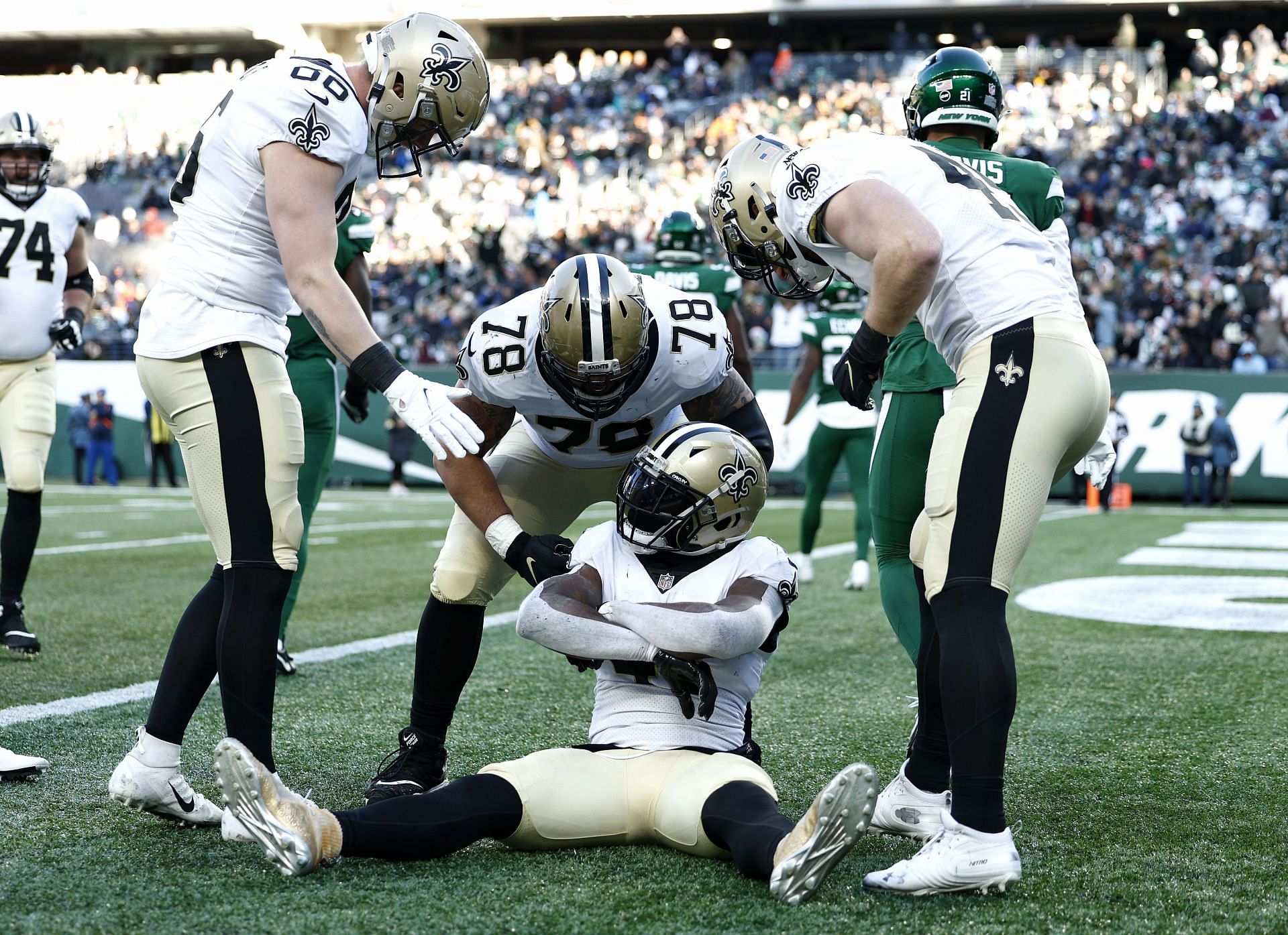 New Orleans Saints players celebrate in the endzone