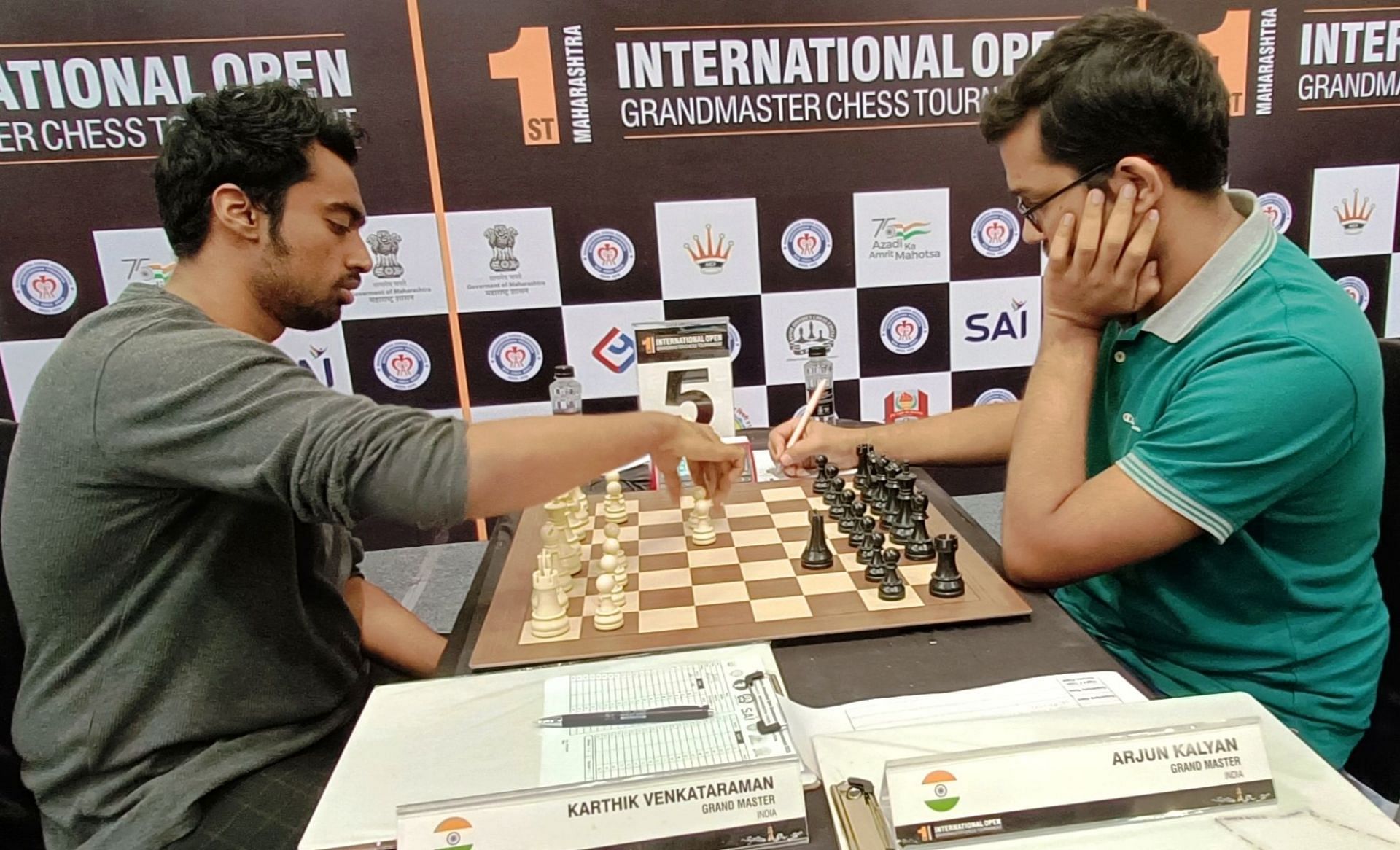 GM Karthik Venkatraman (L) makes a move during his ninth-round match against GM Arjun Kalyan in the chess meet. (Pic credit: AICF)