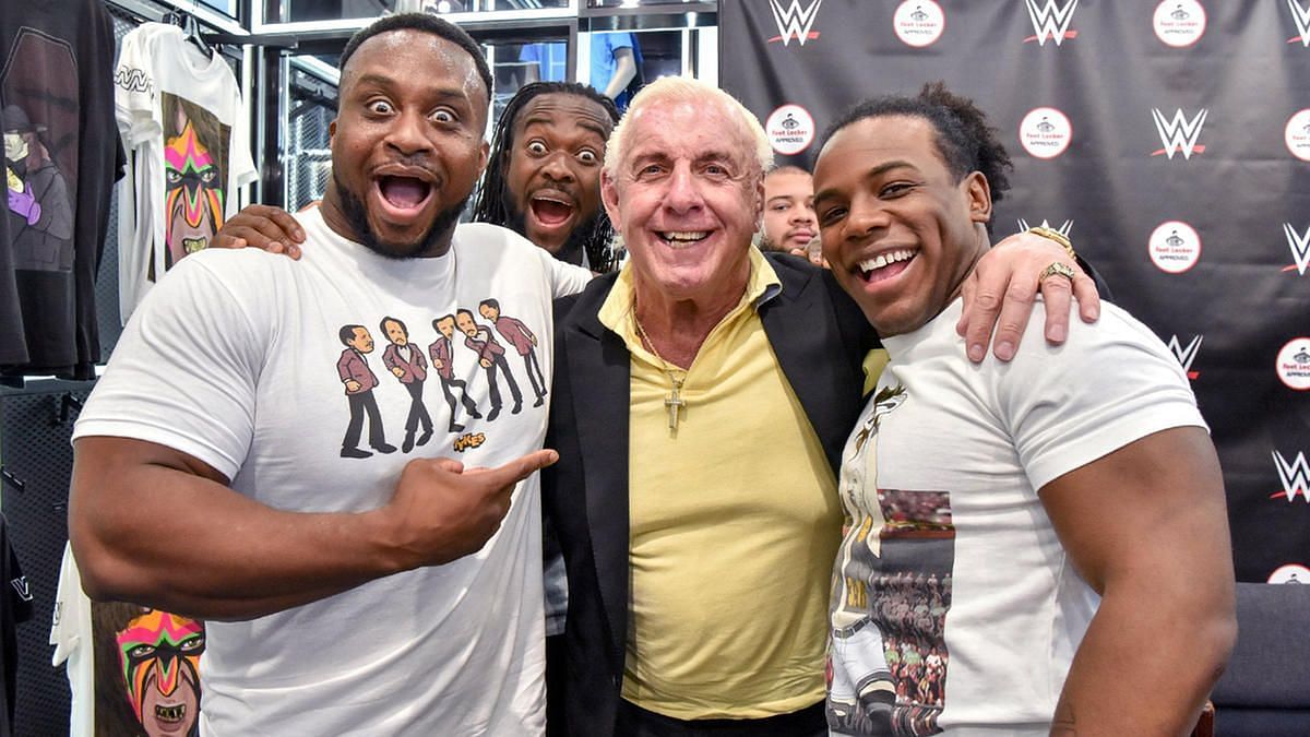 Ric Flair is pictured with members of The New Day
