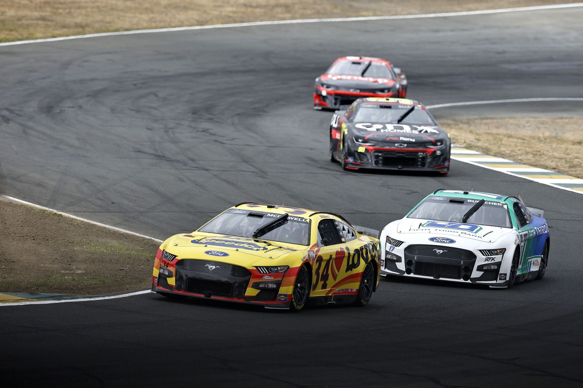 Michael McDowell (foreground) and Chris Buescher (background) race during the NASCAR Cup Series Toyota/Save Mart 350 at Sonoma Raceway (Photo by Sean Gardner/Getty Images)