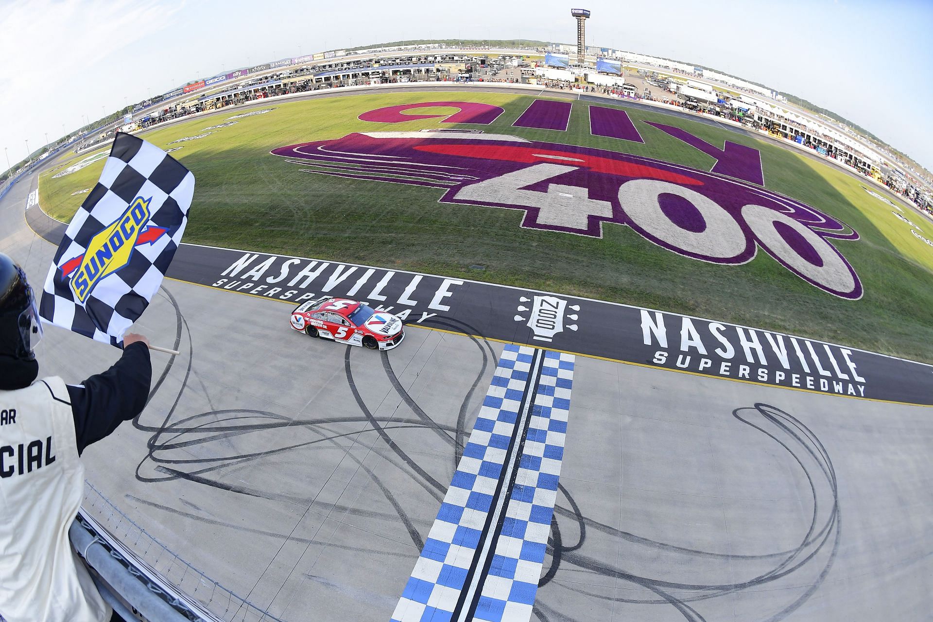 Kyle Larson takes the checkered flag to win the NASCAR Cup Series Ally 400 at Nashville Superspeedway (Photo by Logan Riely/Getty Images)