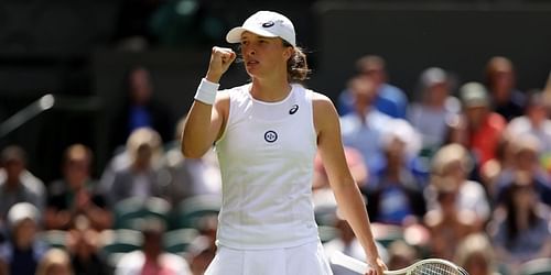 Iga Swiatek celebrates her opening-round win against Jana Fett at Wimbledon.