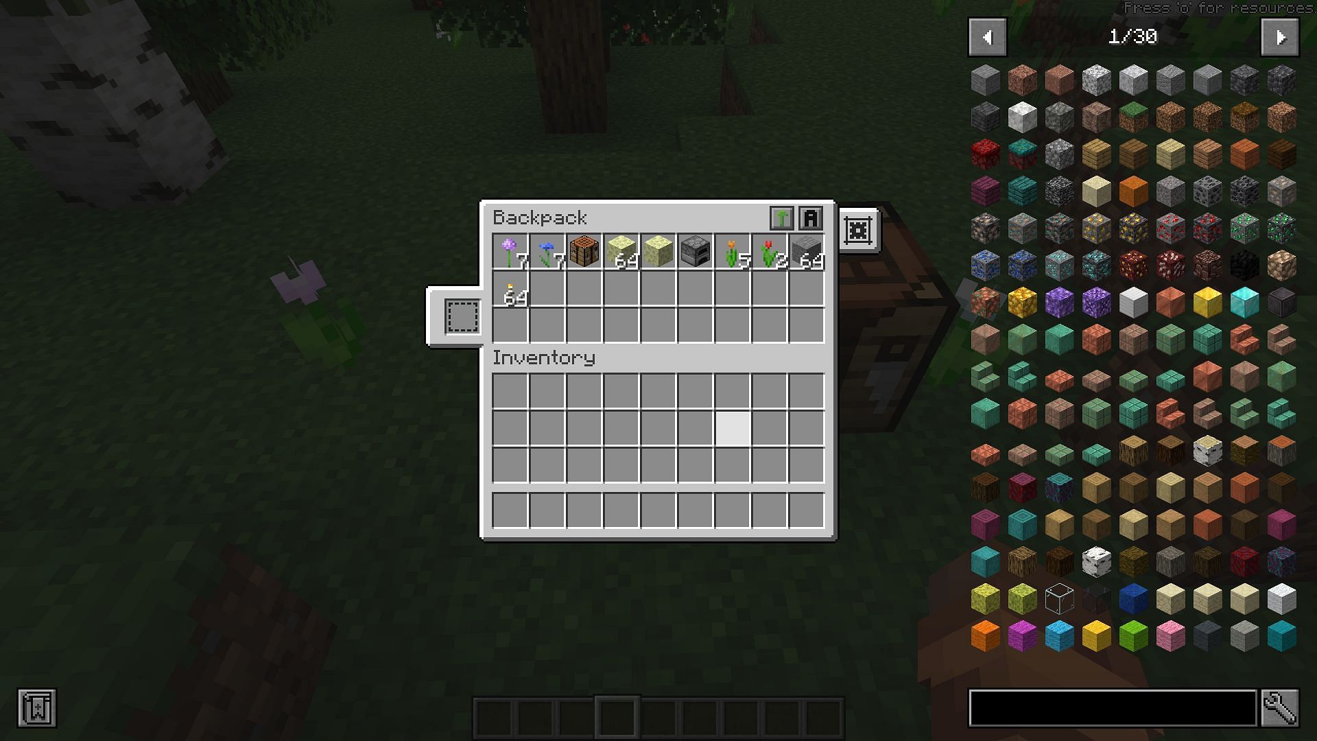 A backpack on the ground being loaded with items (Image via Minecraft)