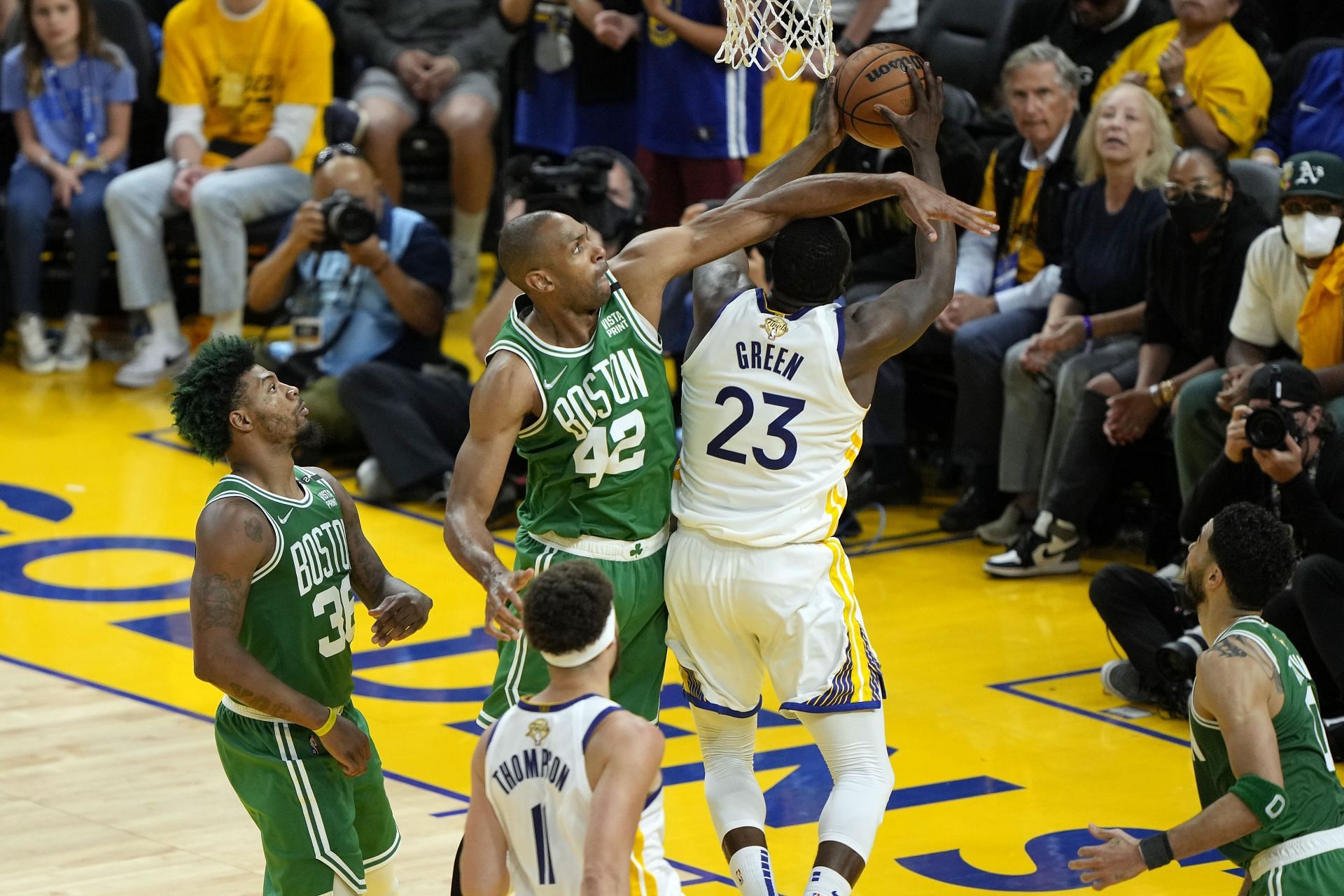 Draymond Green attempts to score off a layup