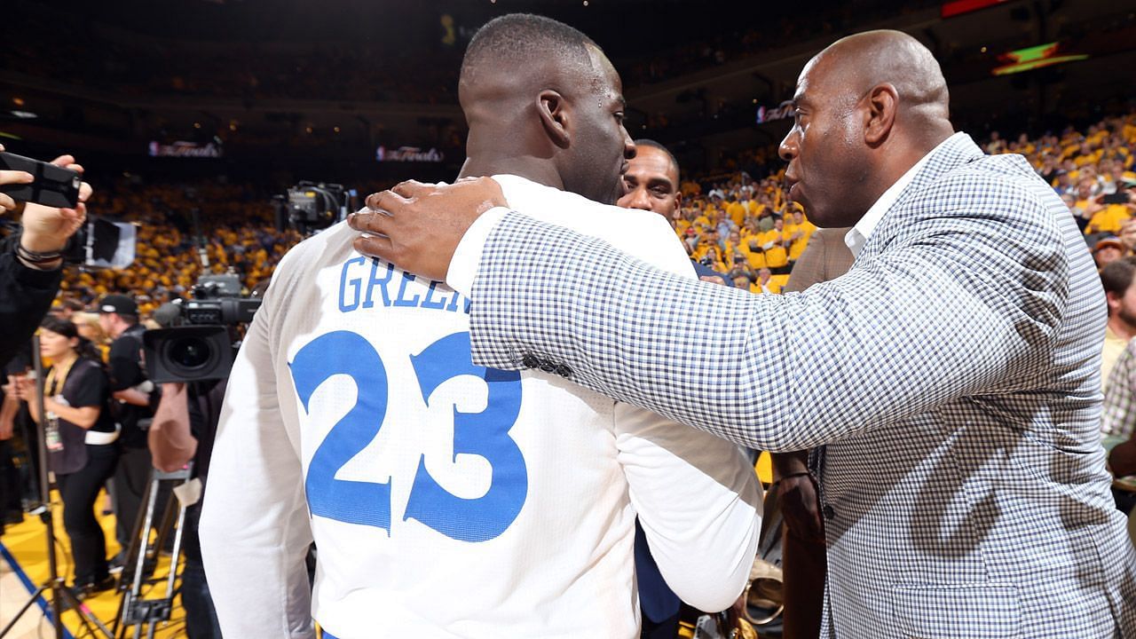 Draymond Green of the Golden State Warriors with LA Lakers legend Magic Johnson.
