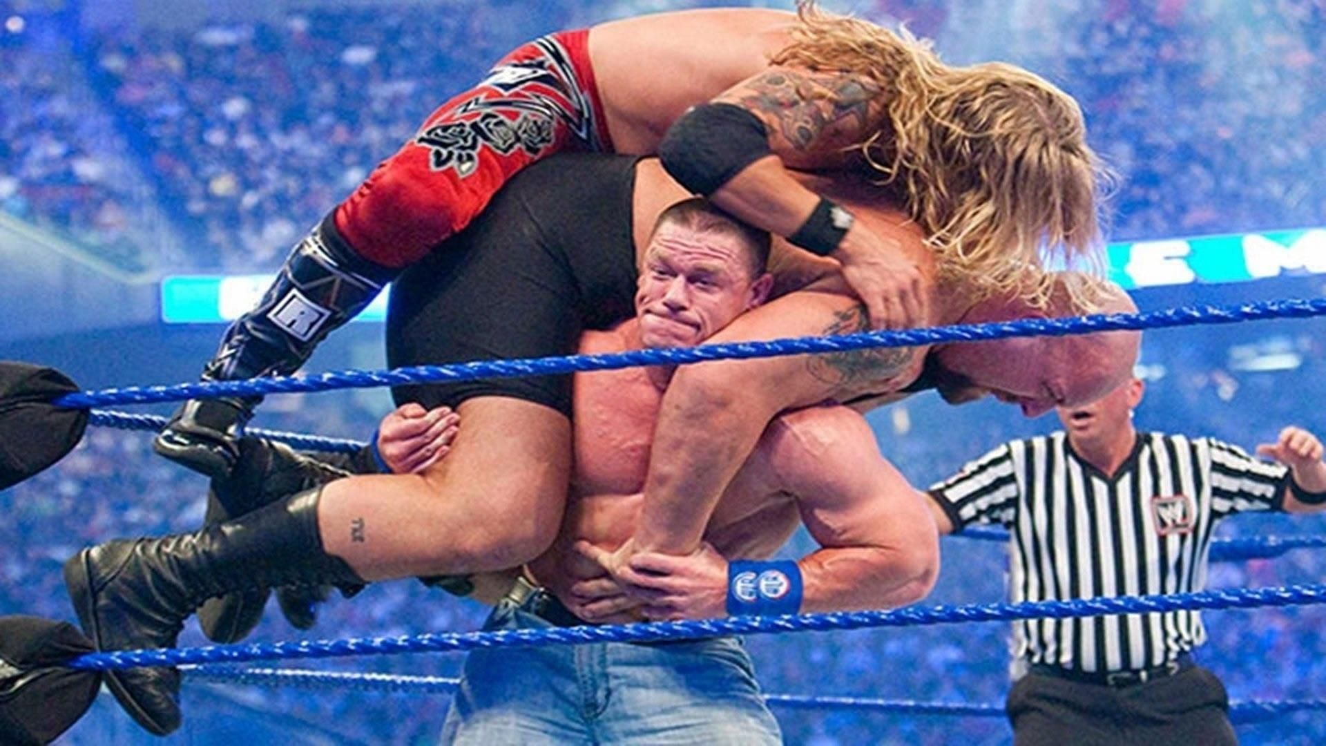 John Cena lifts Edge and Big Show on his shoulders during their WrestleMania 25 bout.