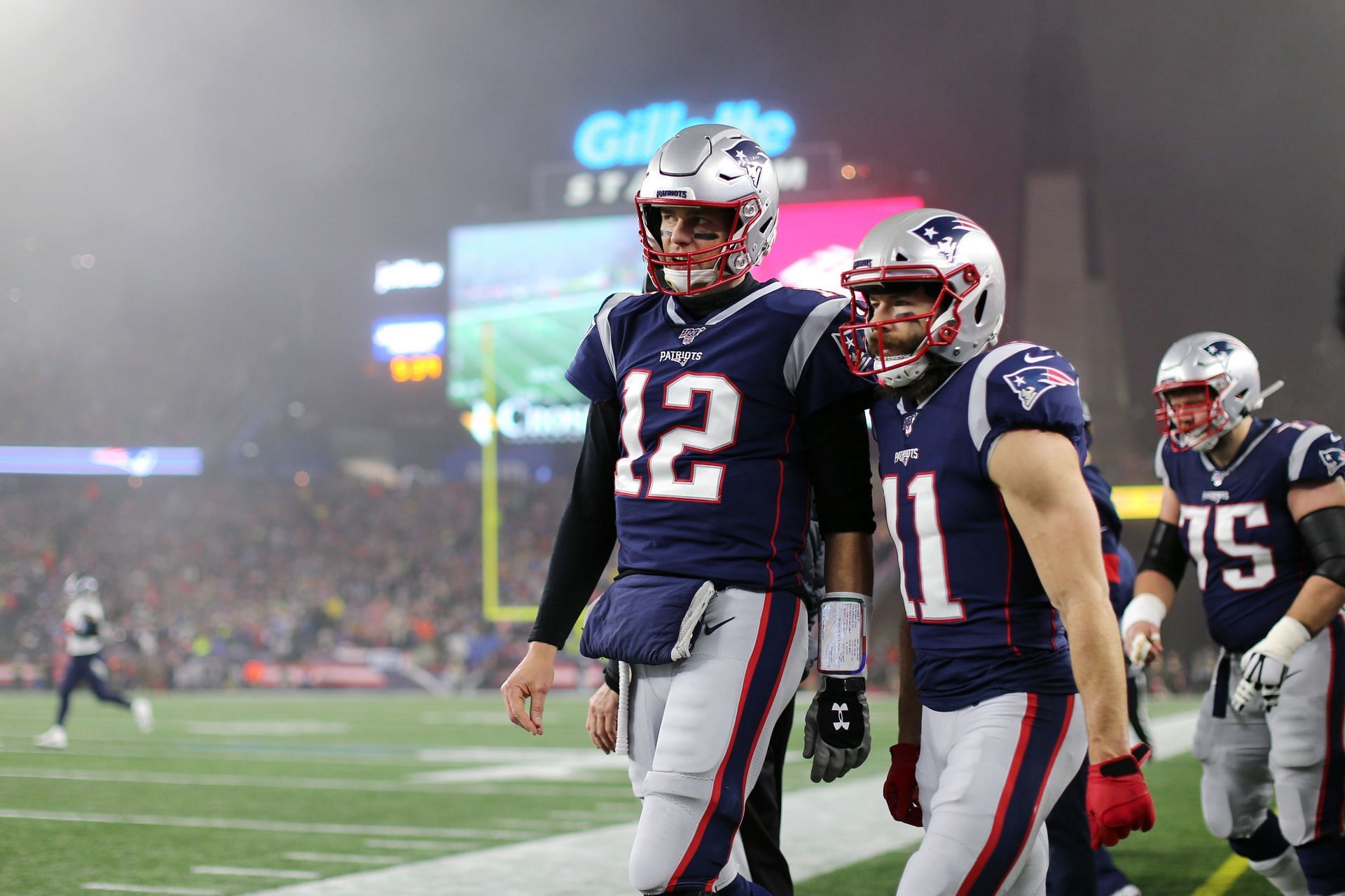 Tom Brady and Julian Edelman on the field