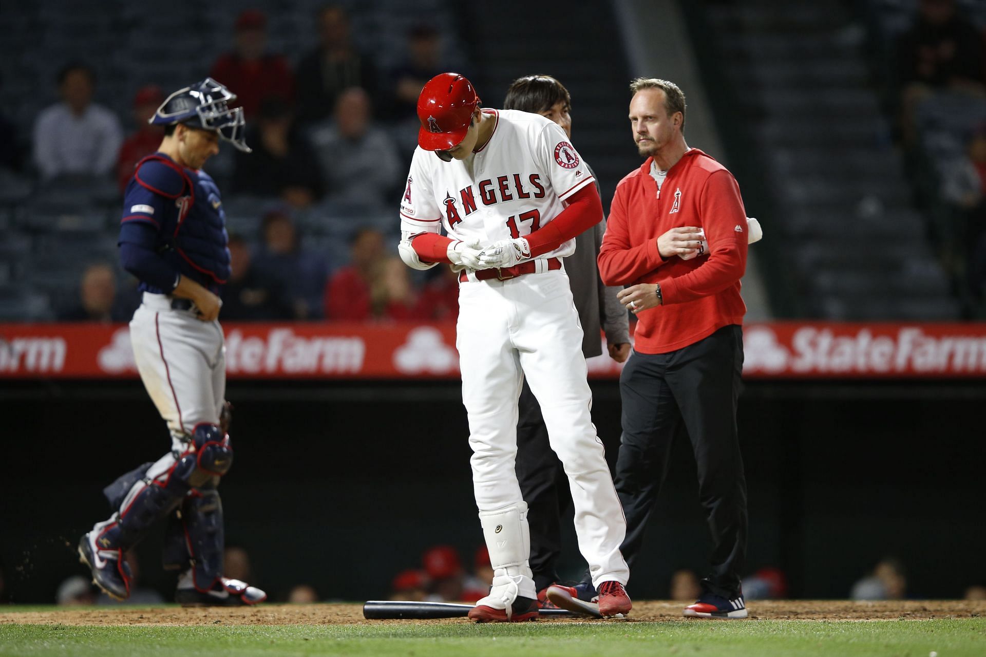 Shohei Ohtani of the Los Angeles Angels reacts to injuring his hand.