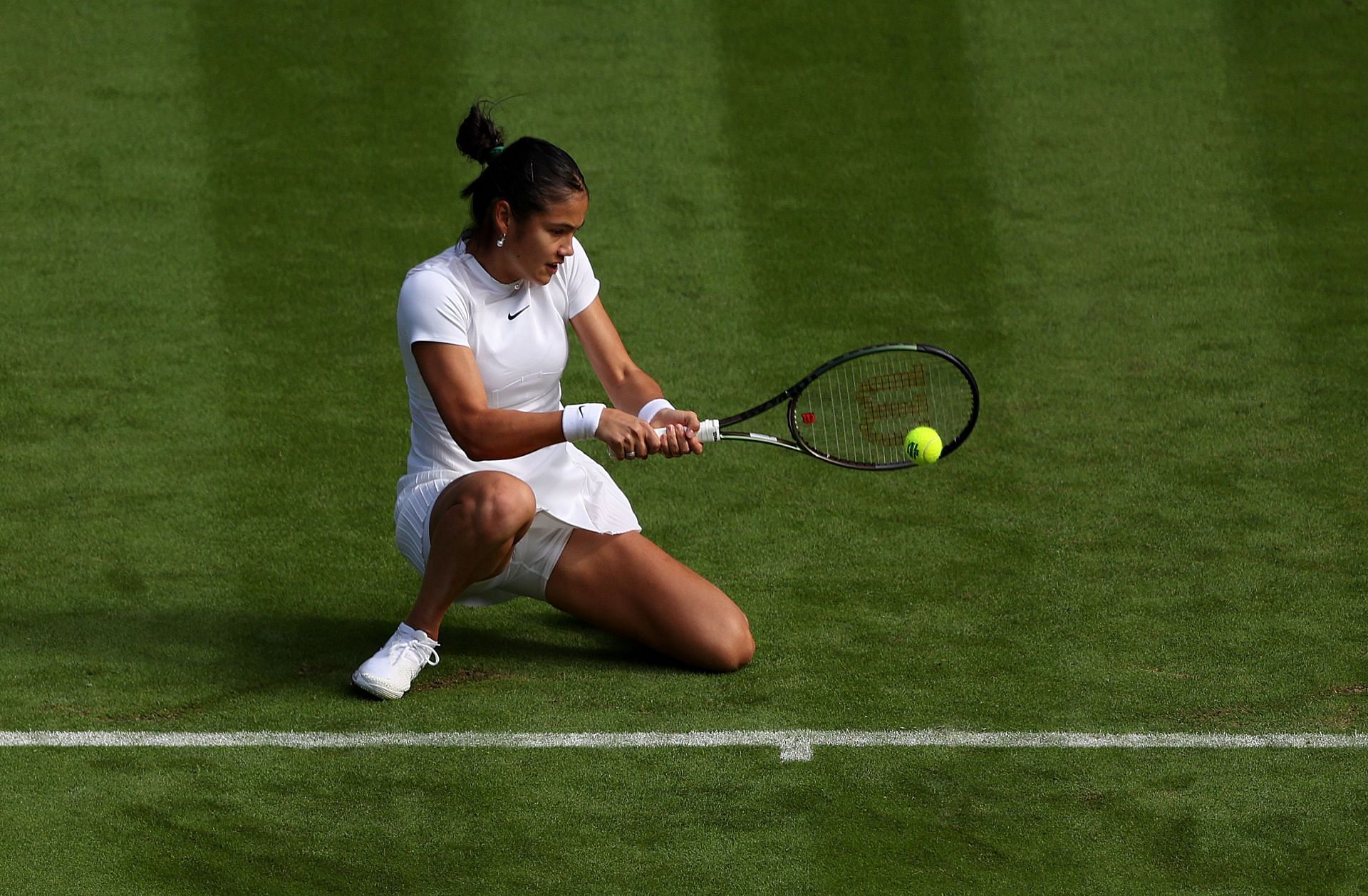 Emma Raducanu strikes the ball during her first-round match at the 2022 Championships