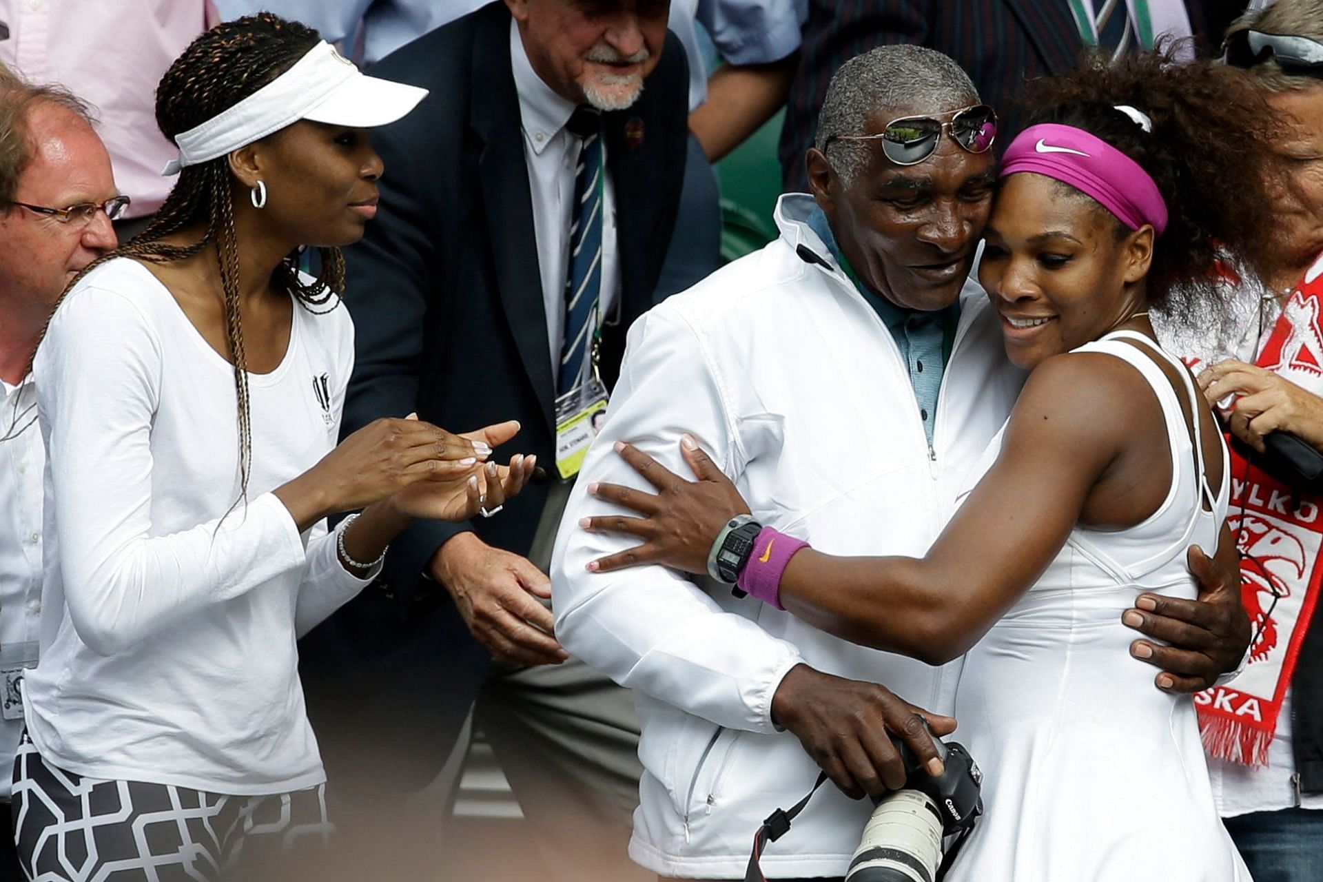 Richard Williams celebrates with Serena and Venus at Wimbledon