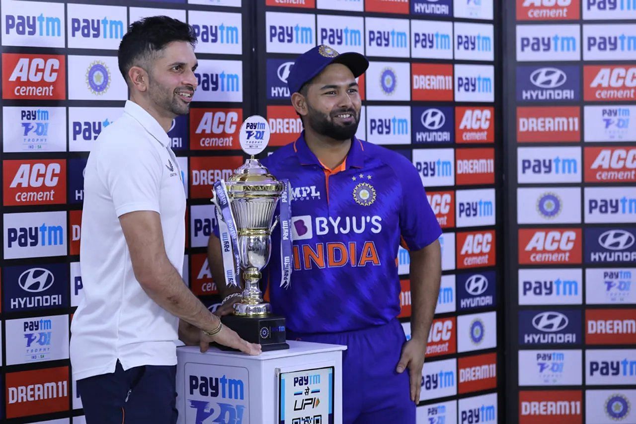 Keshav Maharaj (L) and Rishabh Pant shared the T20I trophy for the India vs South Africa series (Image Courtesy: BCCI)